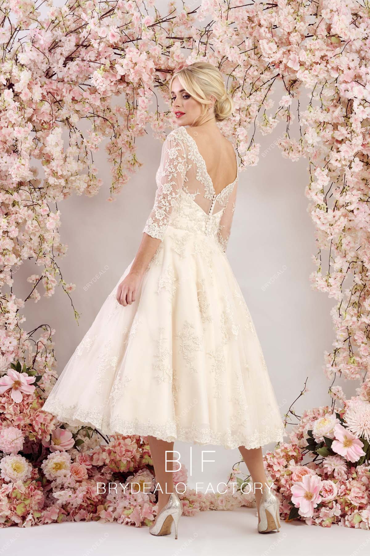 V-back champagne tea length wedding gown