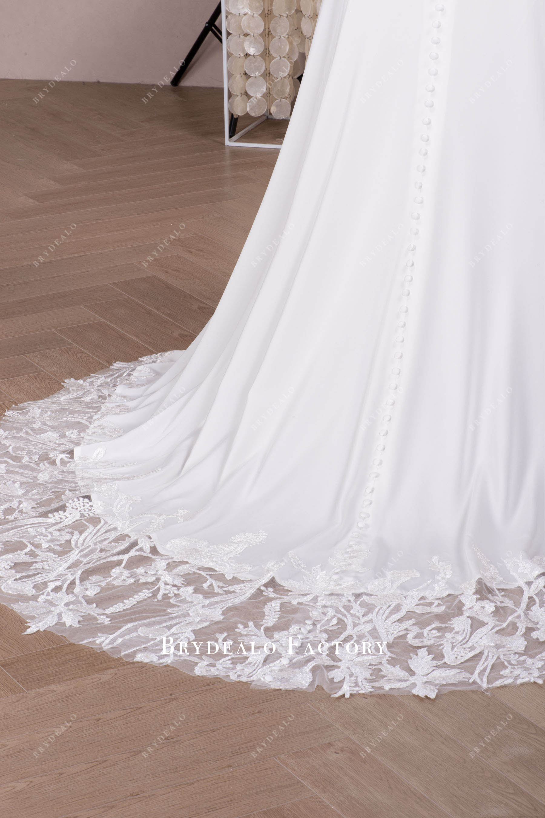 buttoned lace cutout train wedding dress