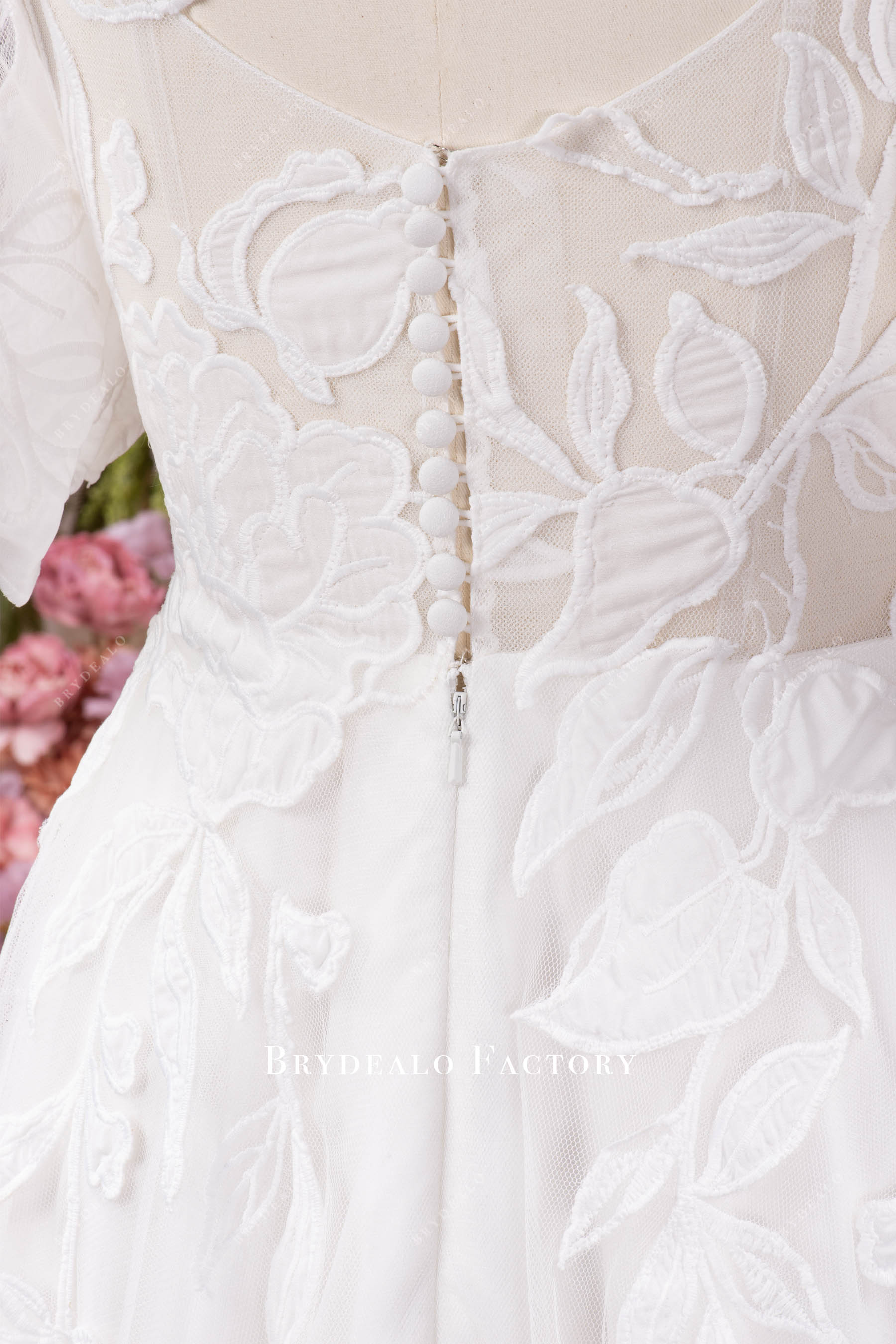 illusion buttoned back wedding gown