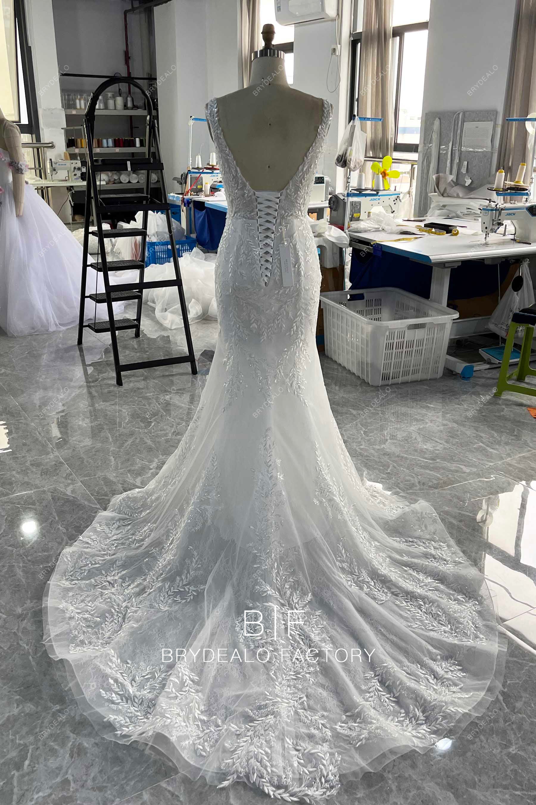 long ruffled skirt lace up back wedding dress