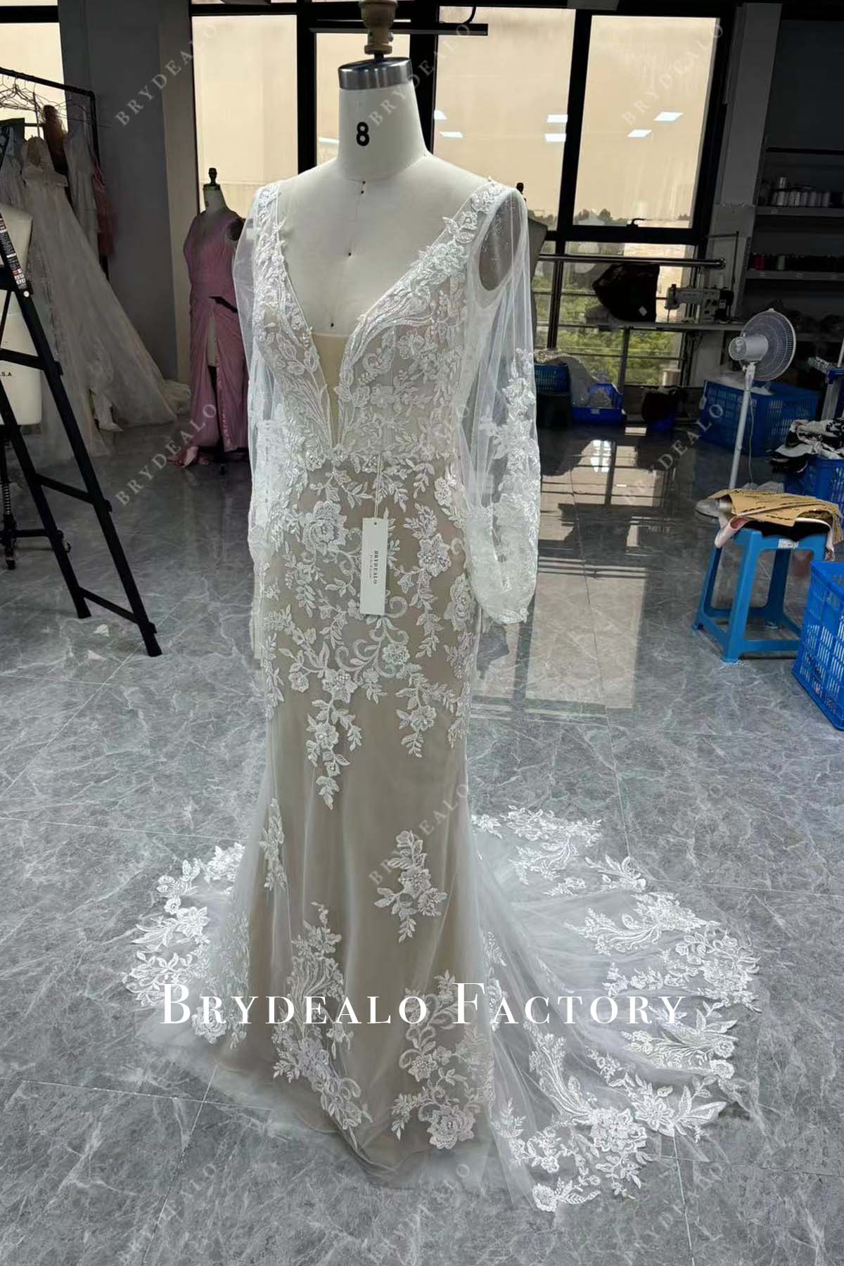 sheer long sleeves fit and flare wedding gown