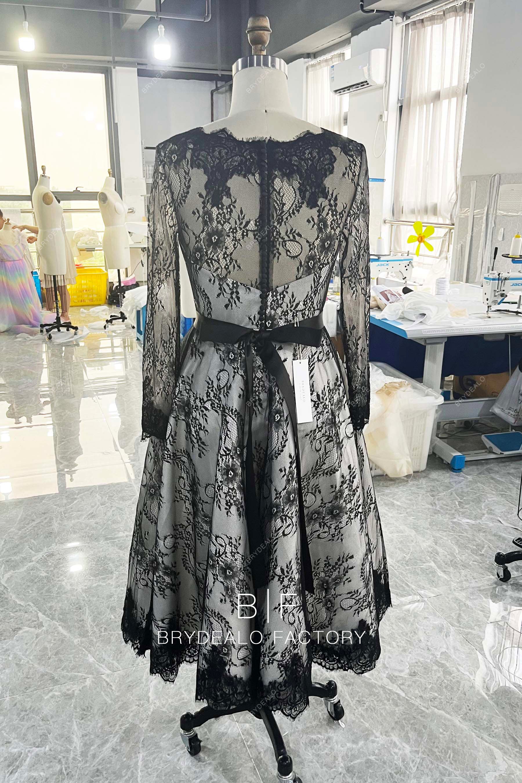 long sleeve illusion buttoned back wedding gown
