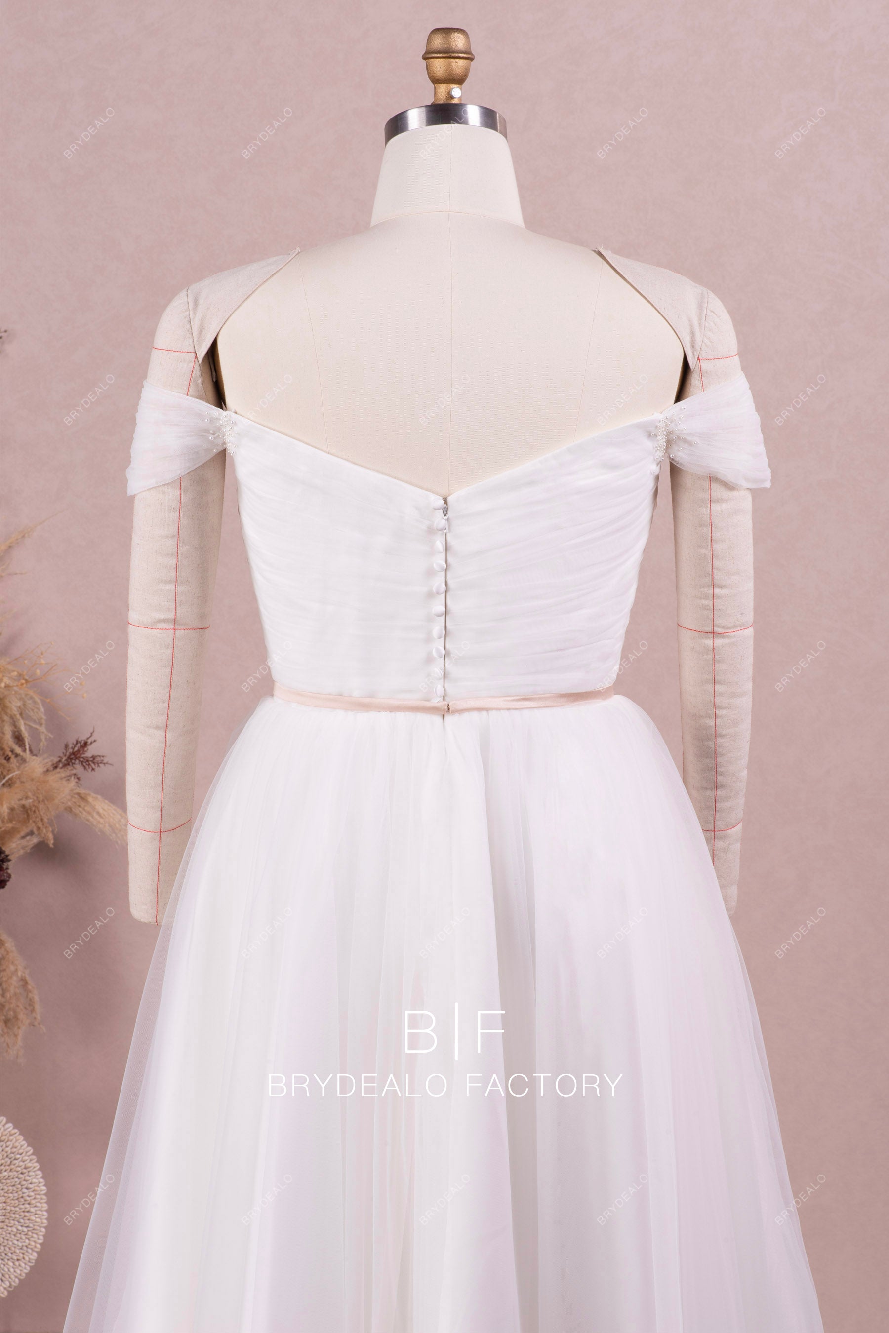 off shoulder buttoned back wedding dress
