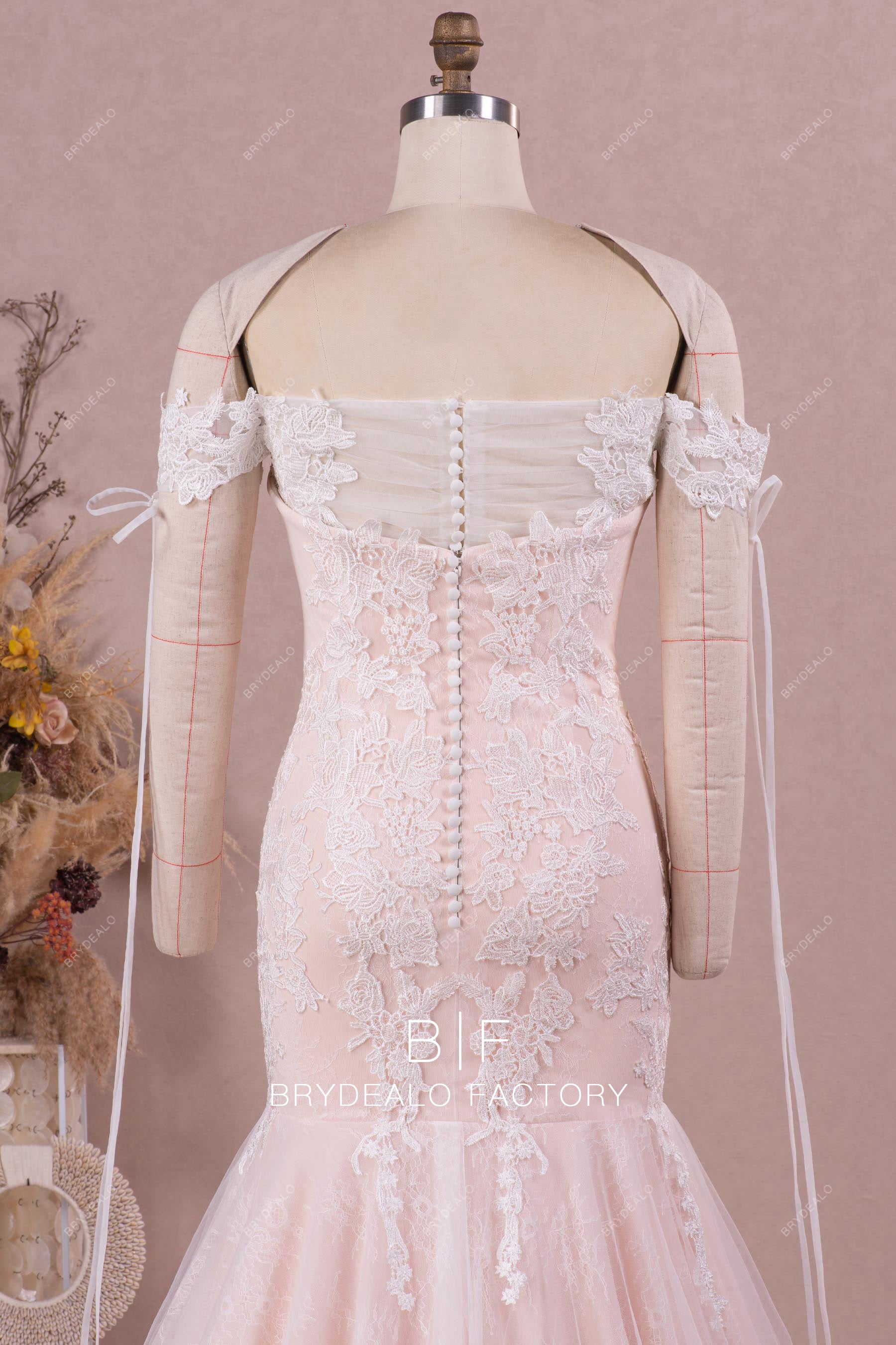 pleated tulle off shoulder buttoned back bridal gown