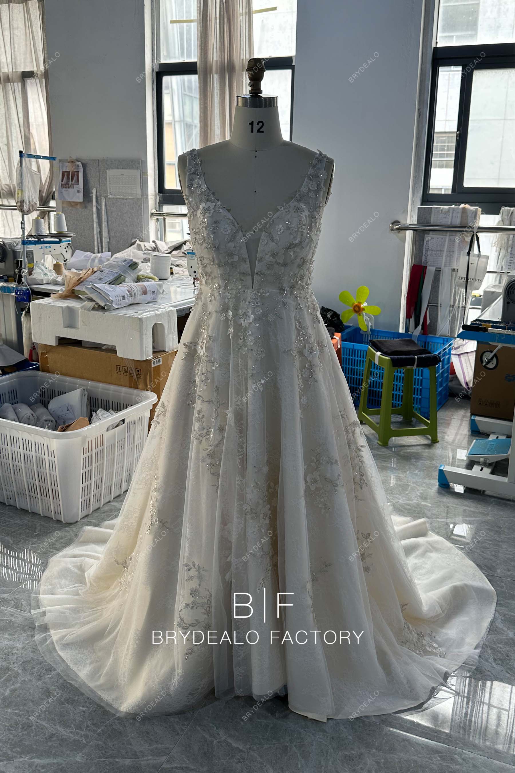 plunging neck sleeveless A-line designer wedding dress