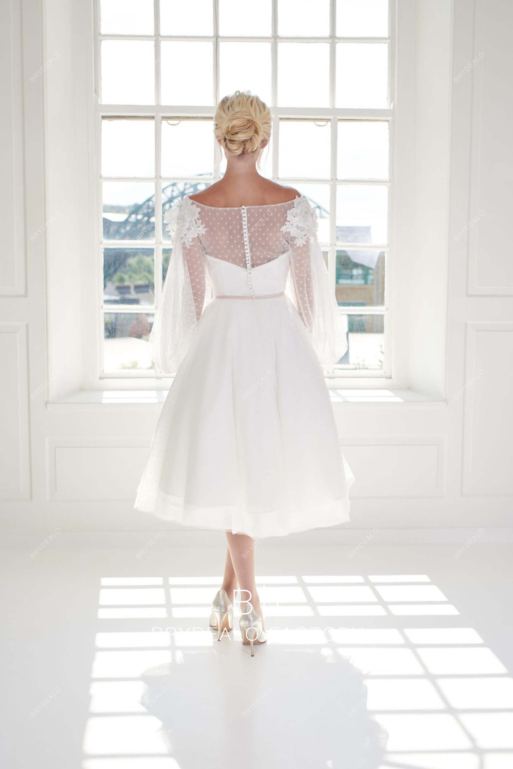 puffy A-line tea length bridal gown