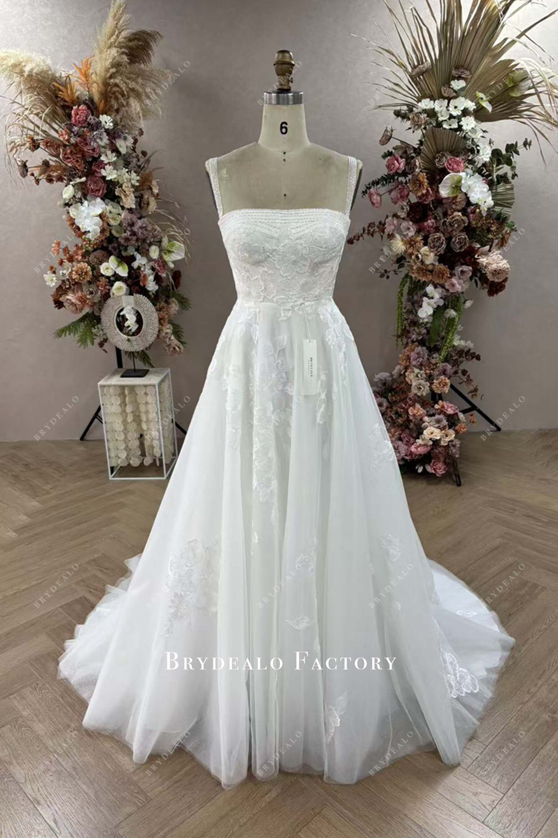 sleeveless A-line lace designer wedding dress