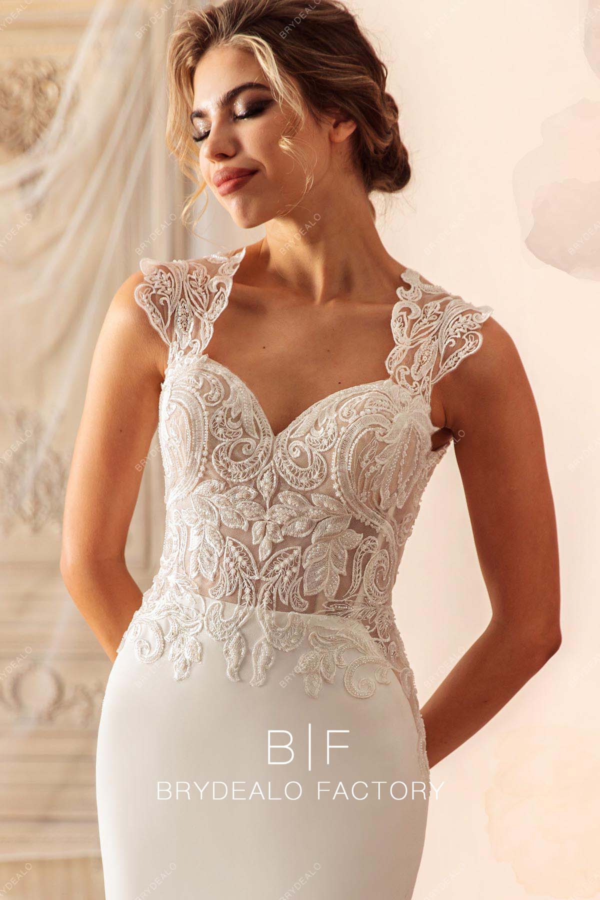 sleeveless illusion queen anne neck wedding dress