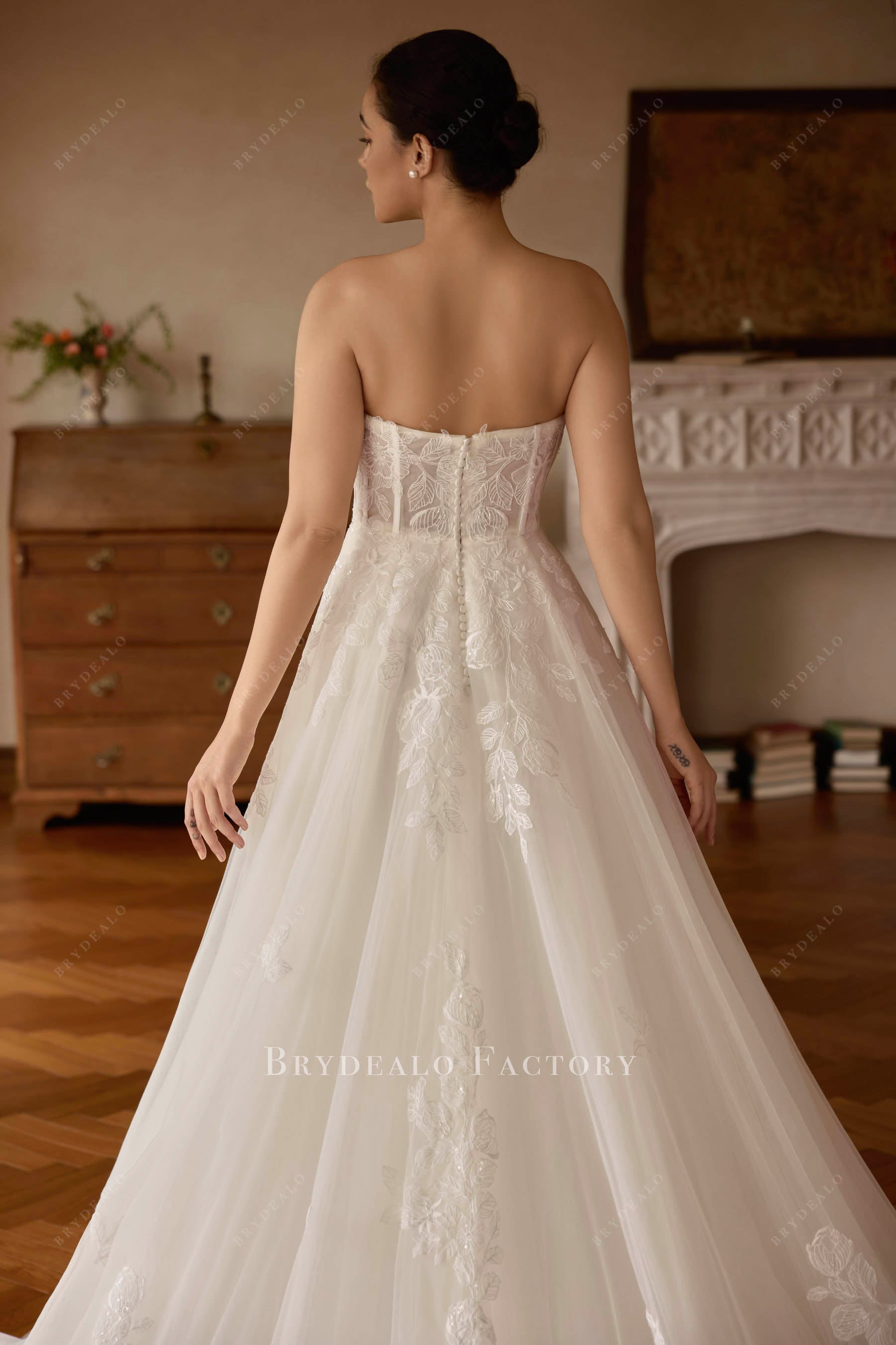 strapless buttoned back wedding dress