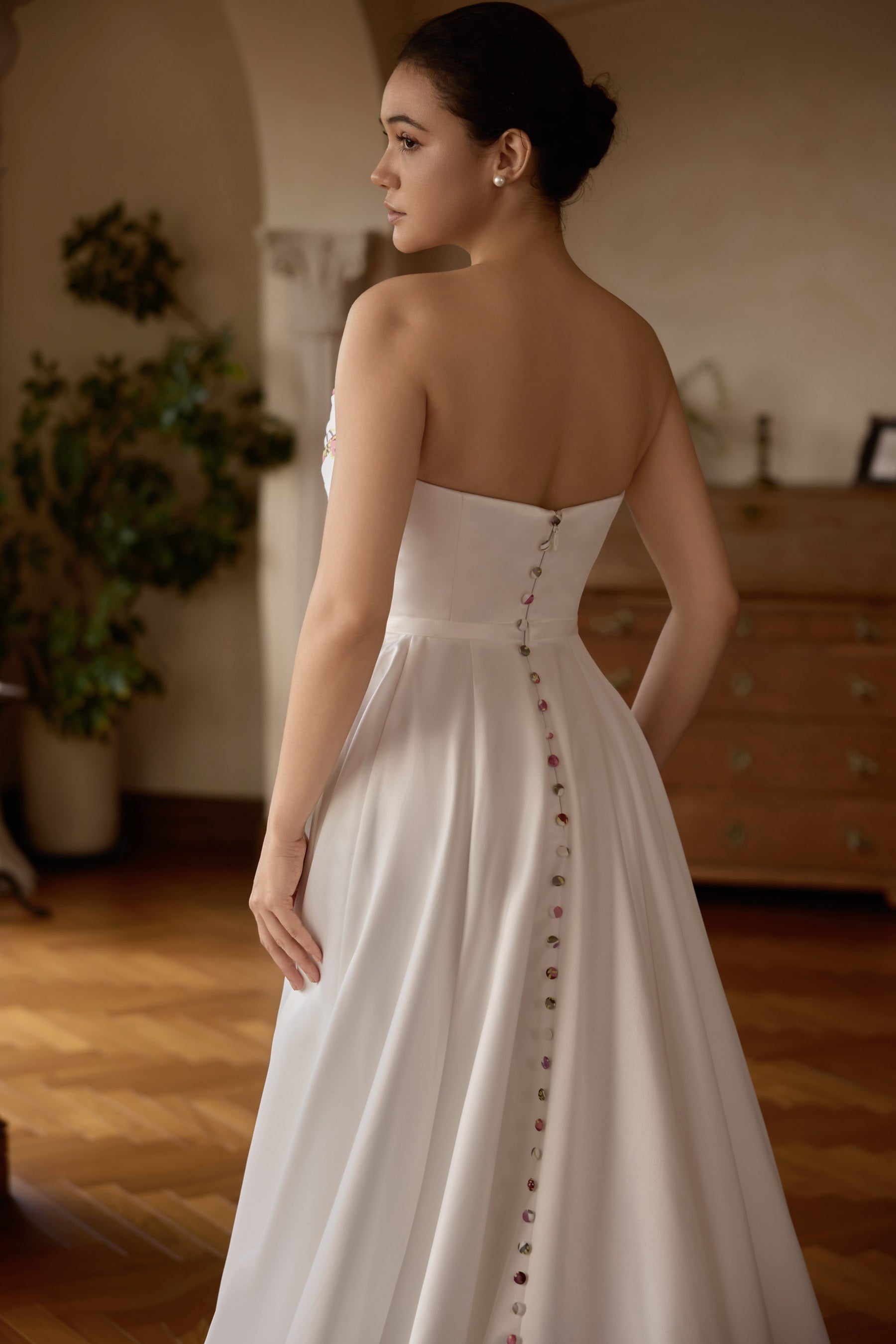 strapless satin buttoned back bridal gown