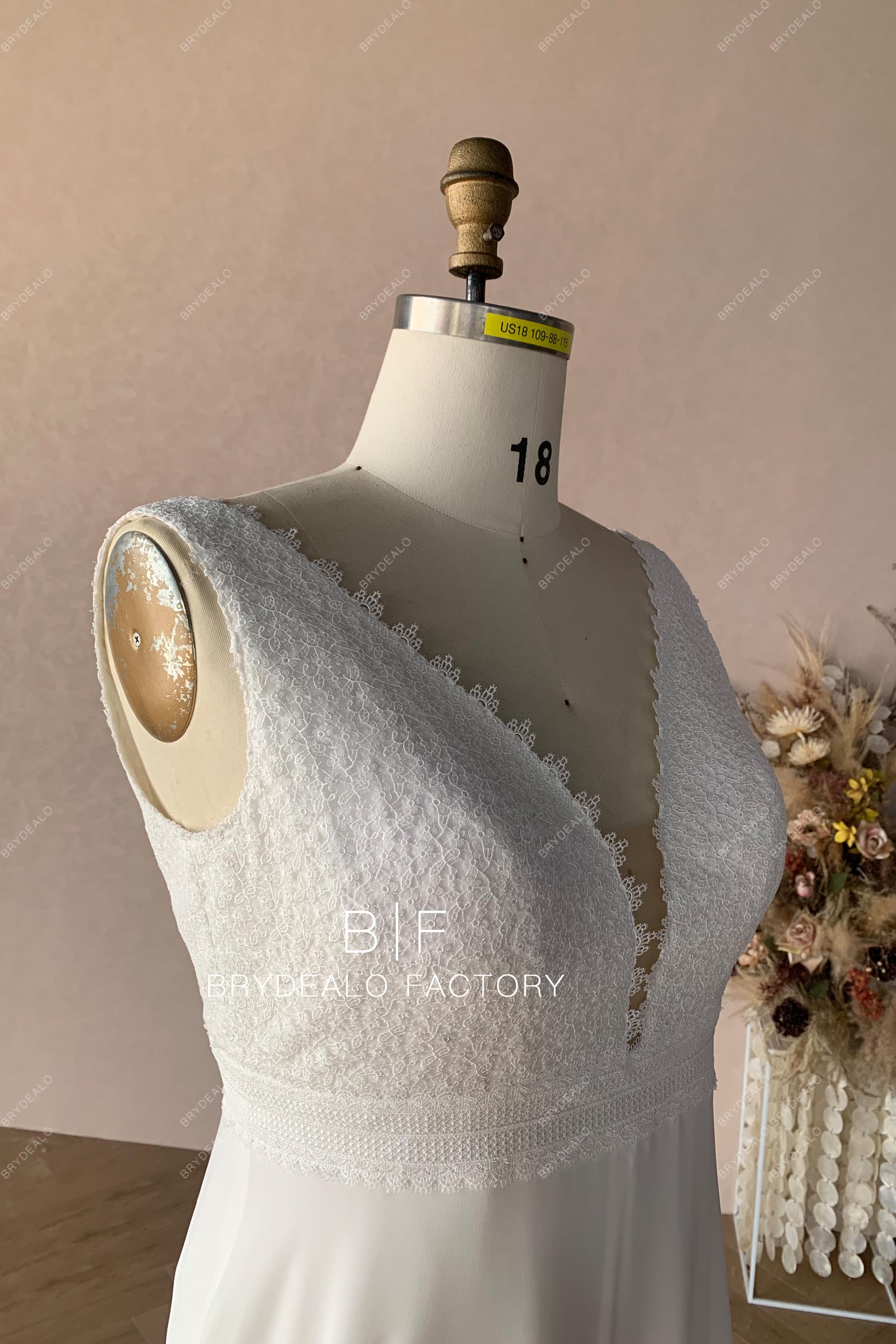 sleeveless designer lace plus size wedding dress