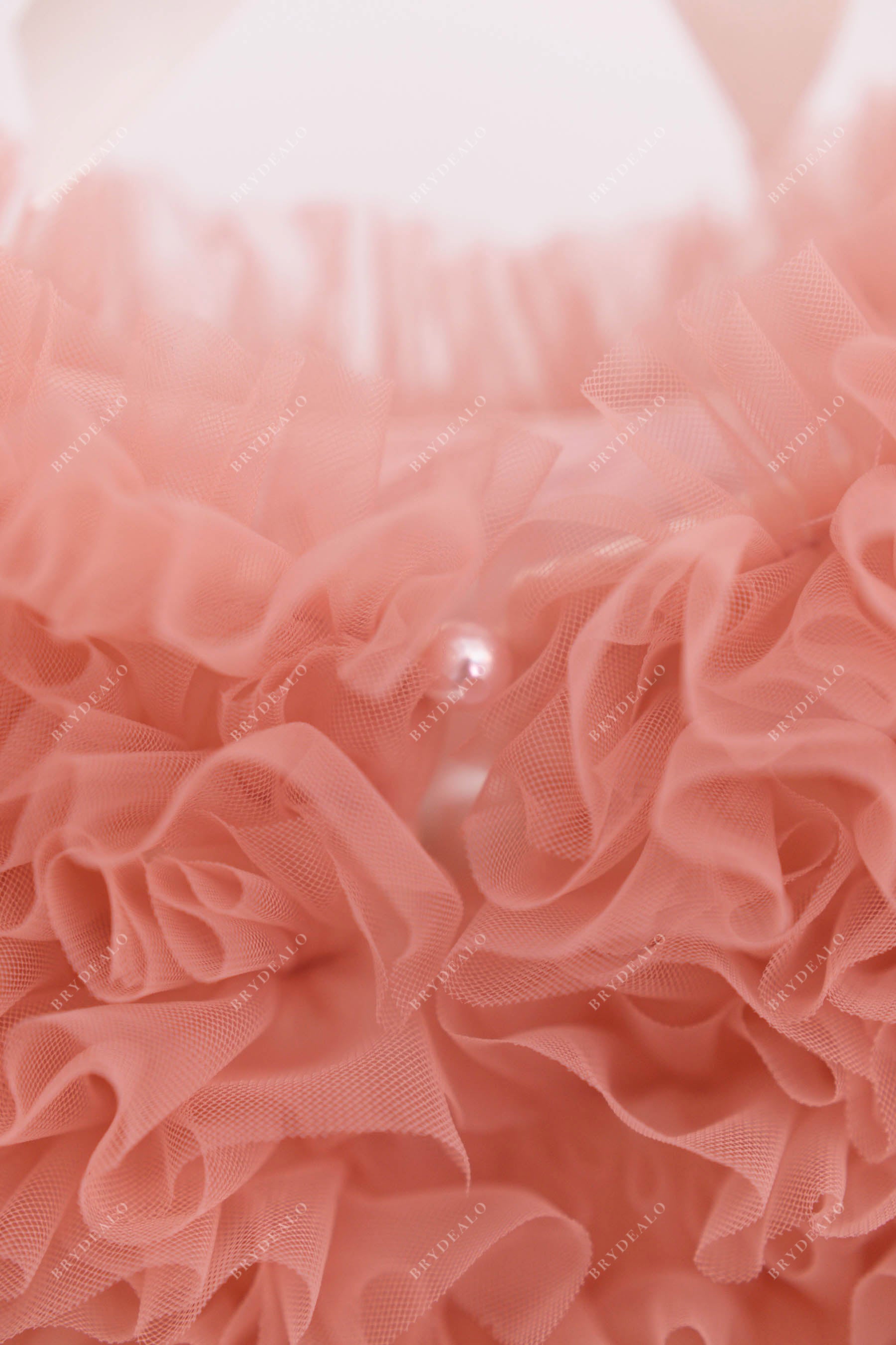coral pink sleeveless ruffled dress