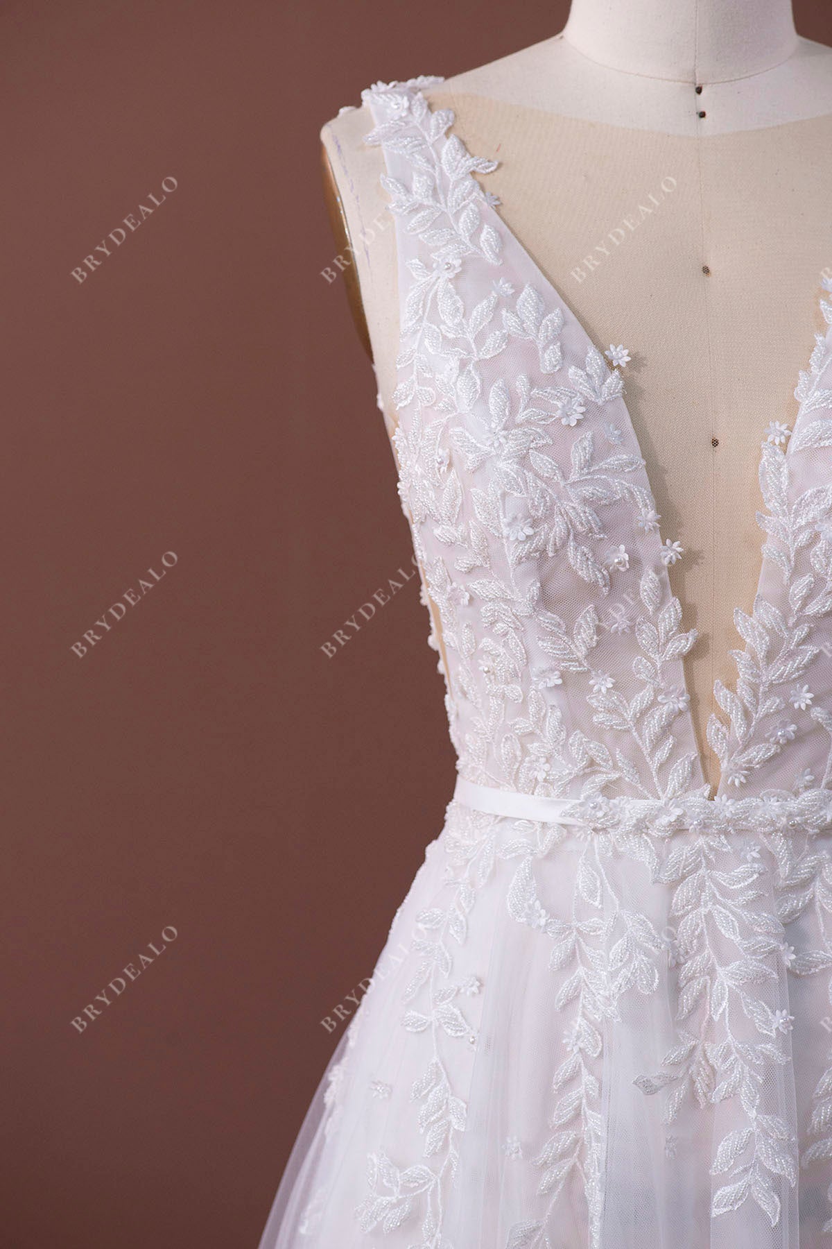 beaded lace plunging sleeveless bridal gown