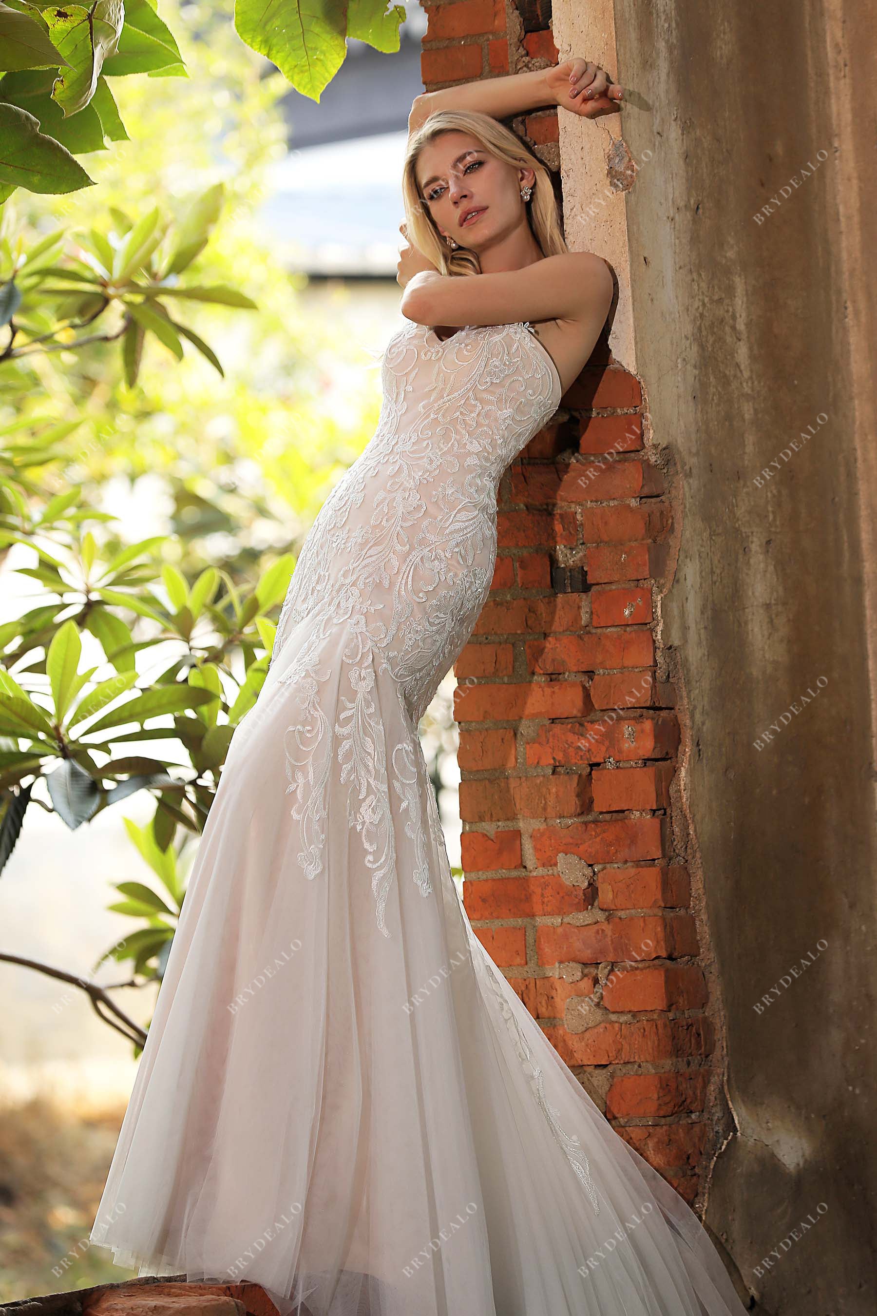 ivory floral lace overlaid nude mermaid wedding dress'
