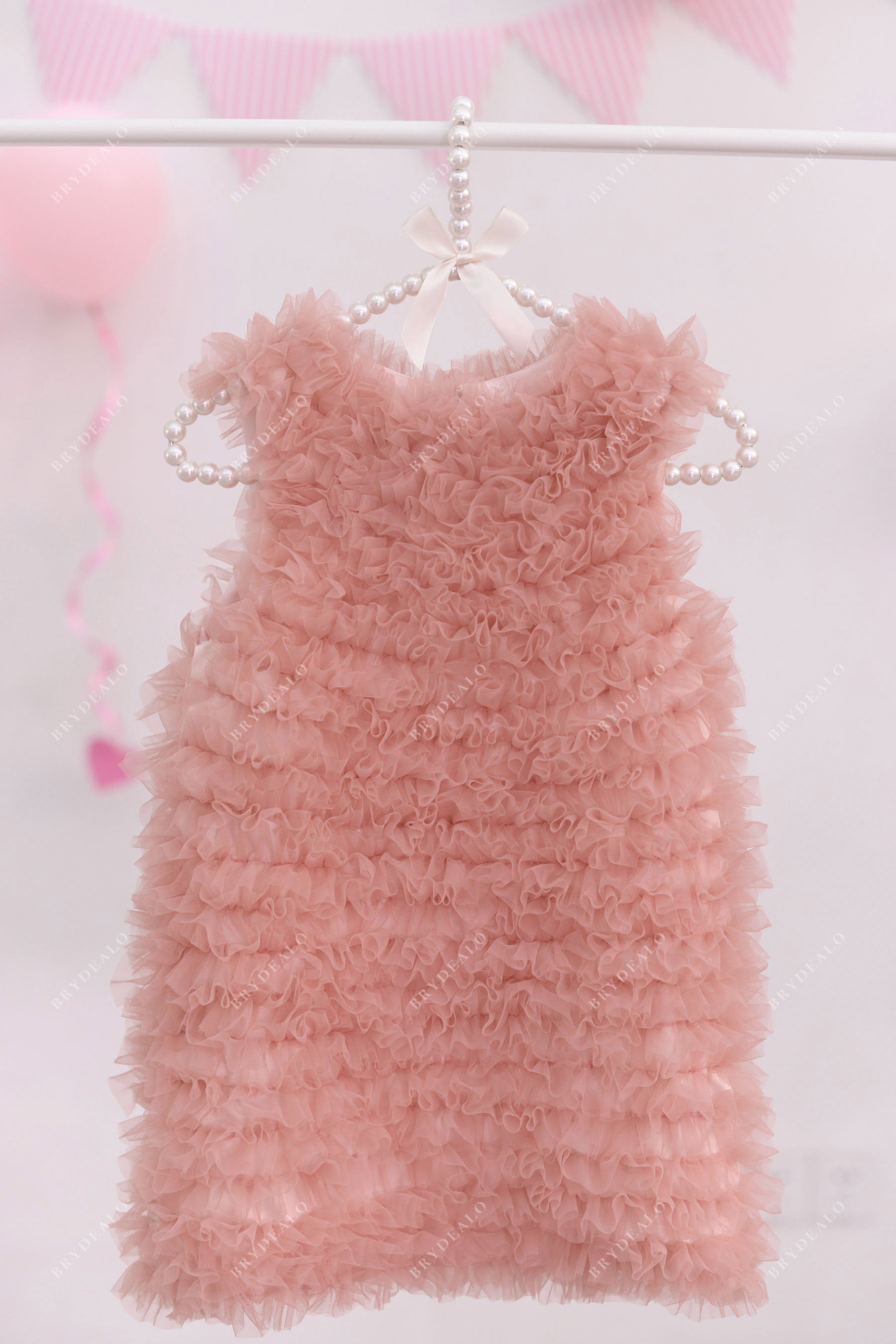 pink sleeveless ruffled dress