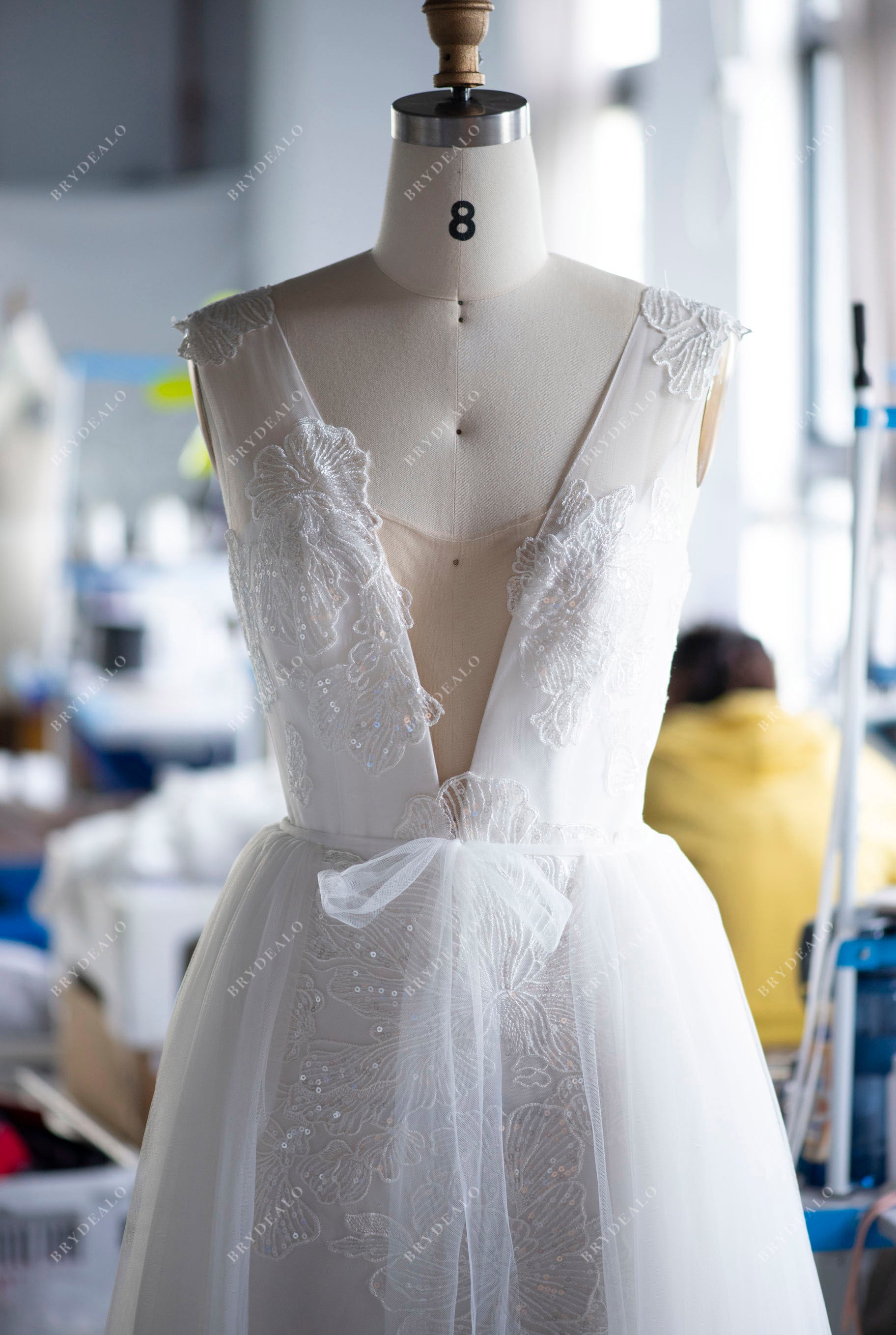 Wholesale Light Ivory Lace Plunging Bridal Gown with Detachable Overskirt