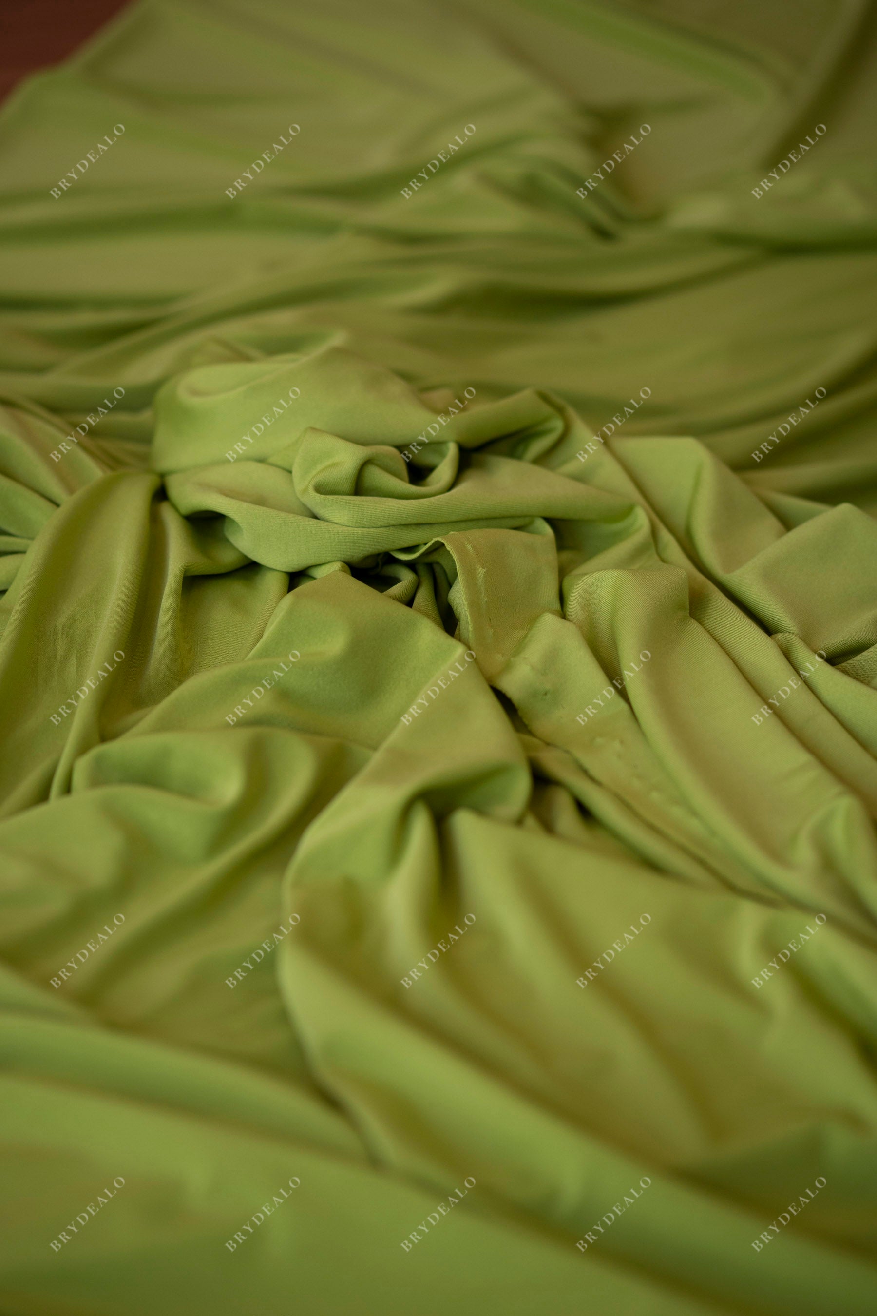 designer draping elastic moss green jersey fabric