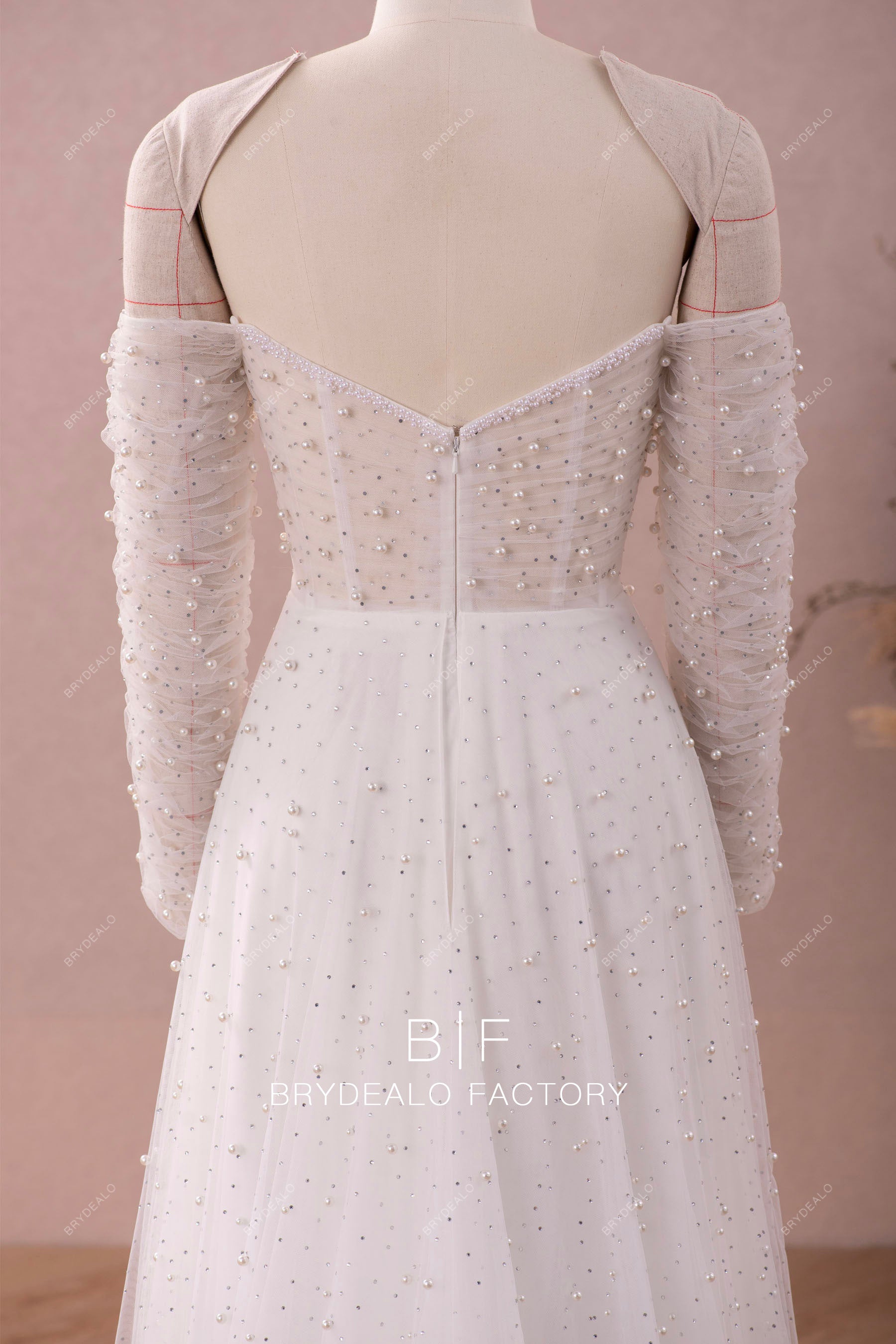 illusion bodice sleeved A-line wedding gown