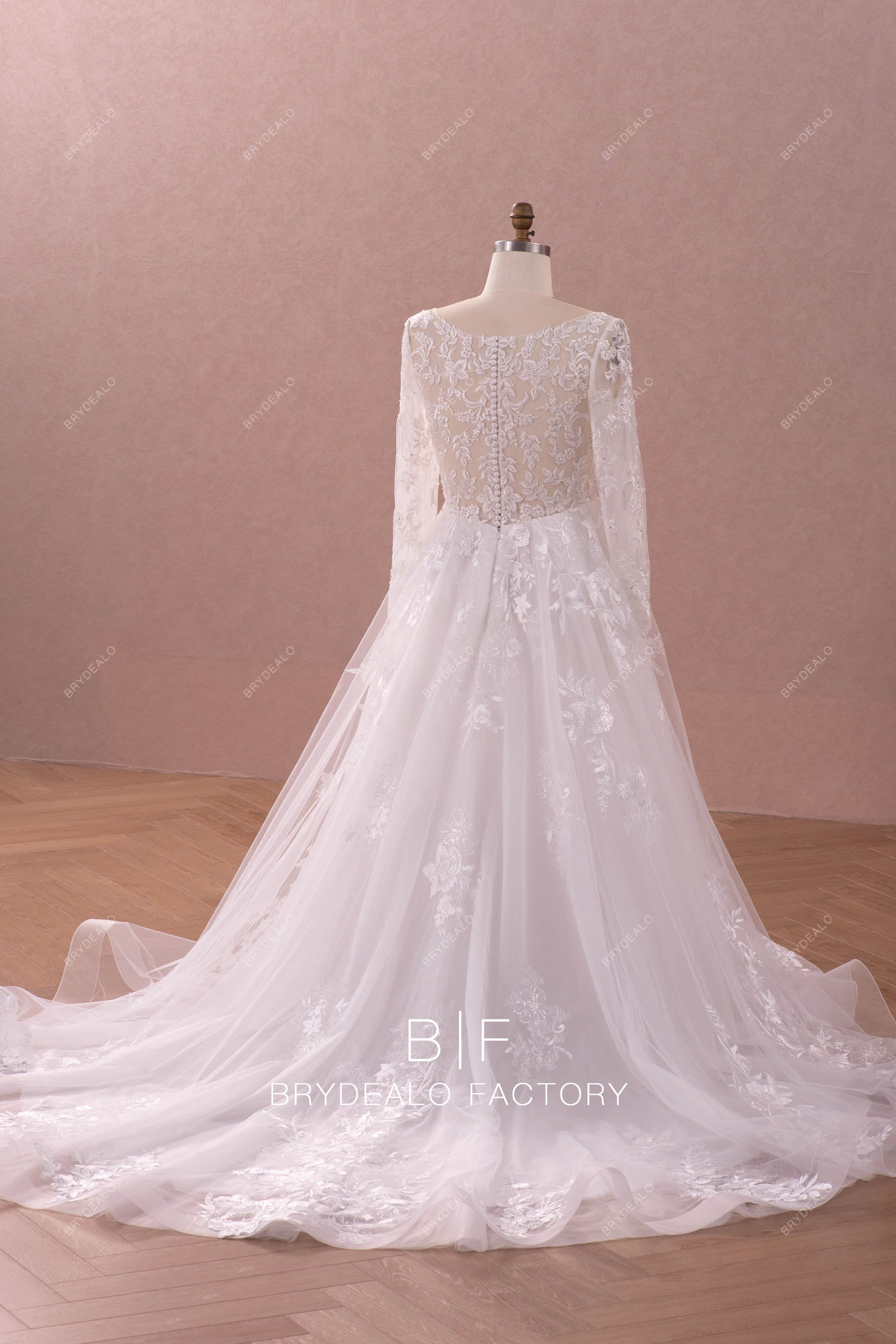 long ruffled train sleeved lace wedding gown