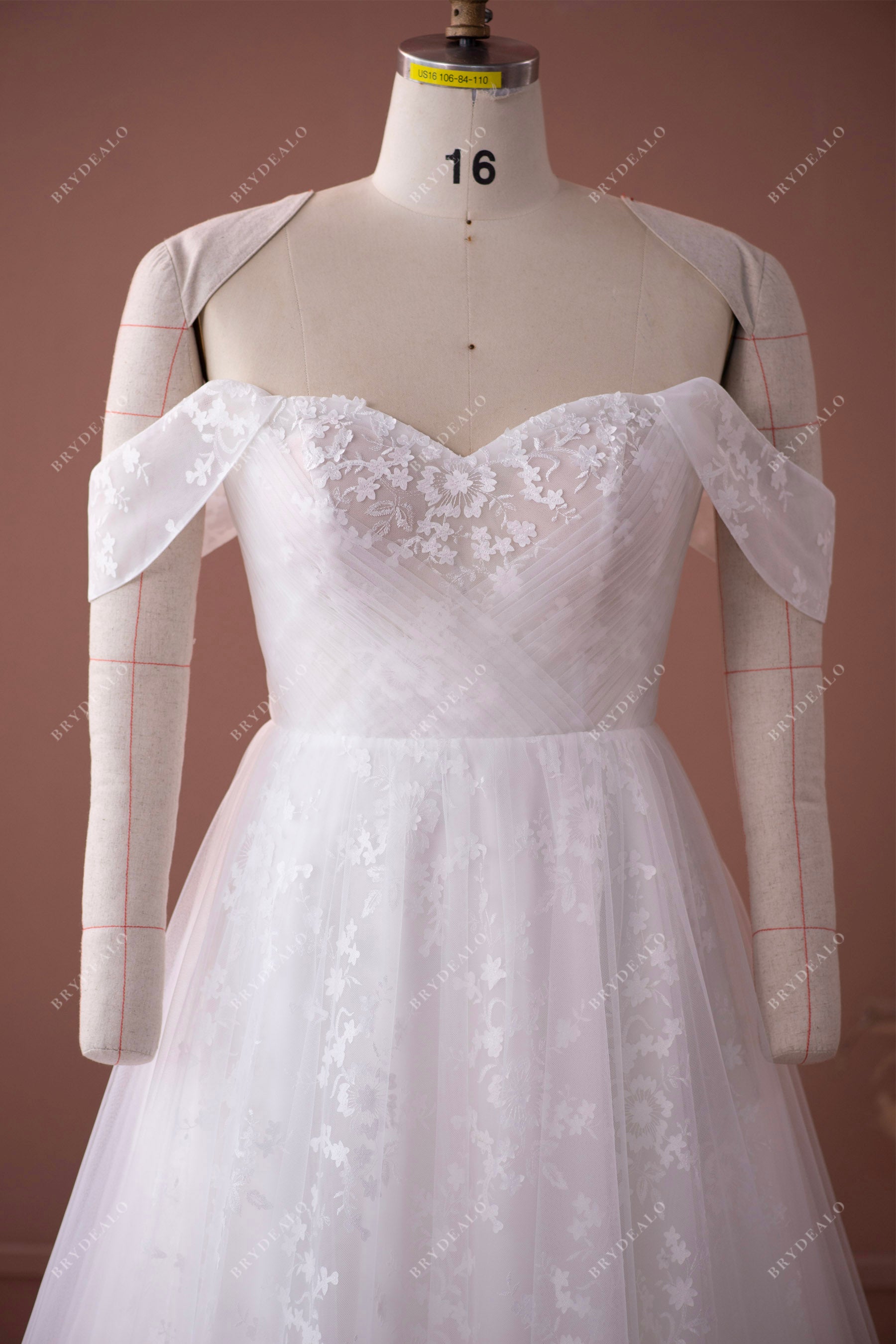 off shoulder crisscross pleated tulle overlaid lace bridal gown