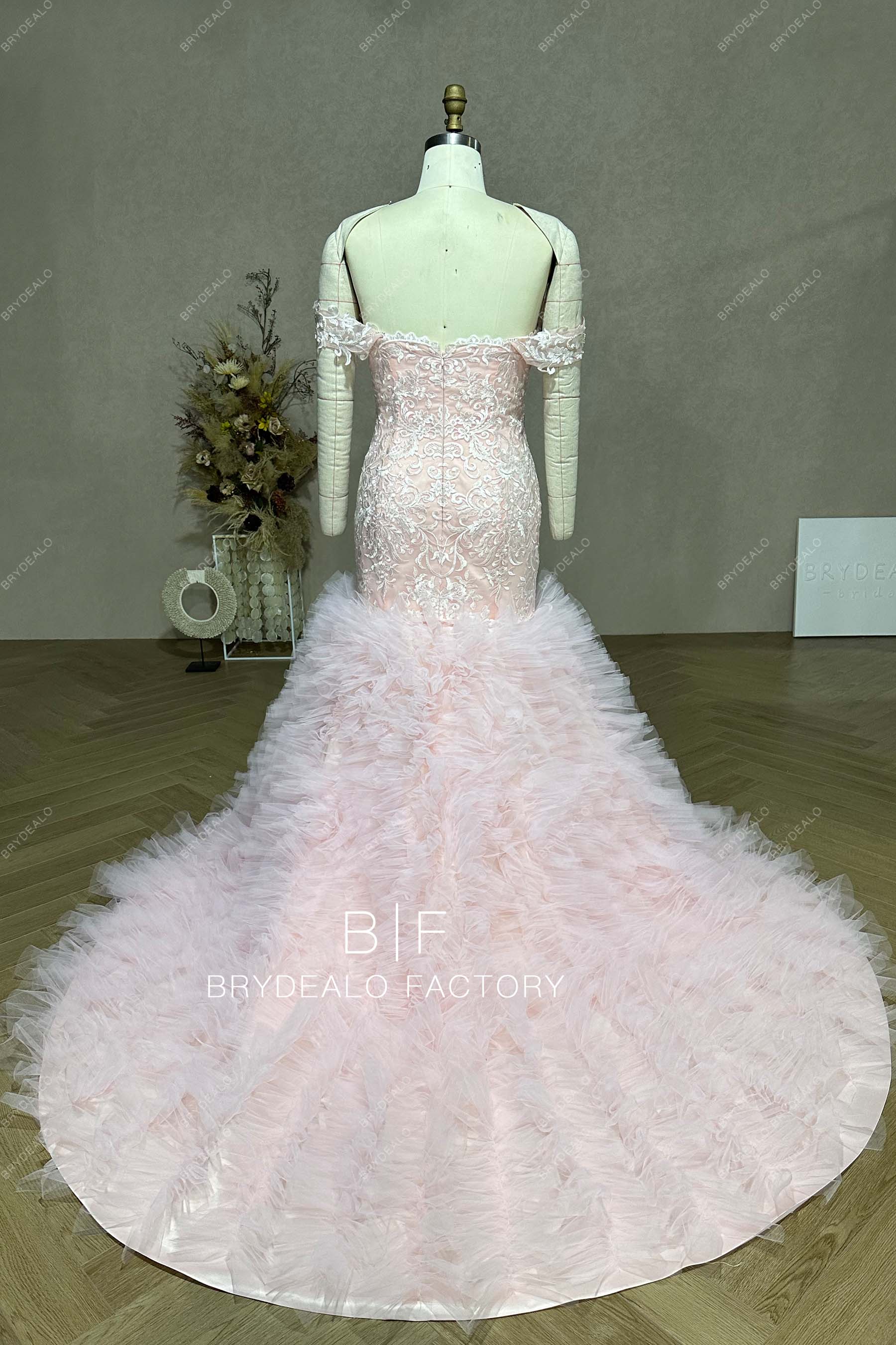 open back ruffled long train wedding gown