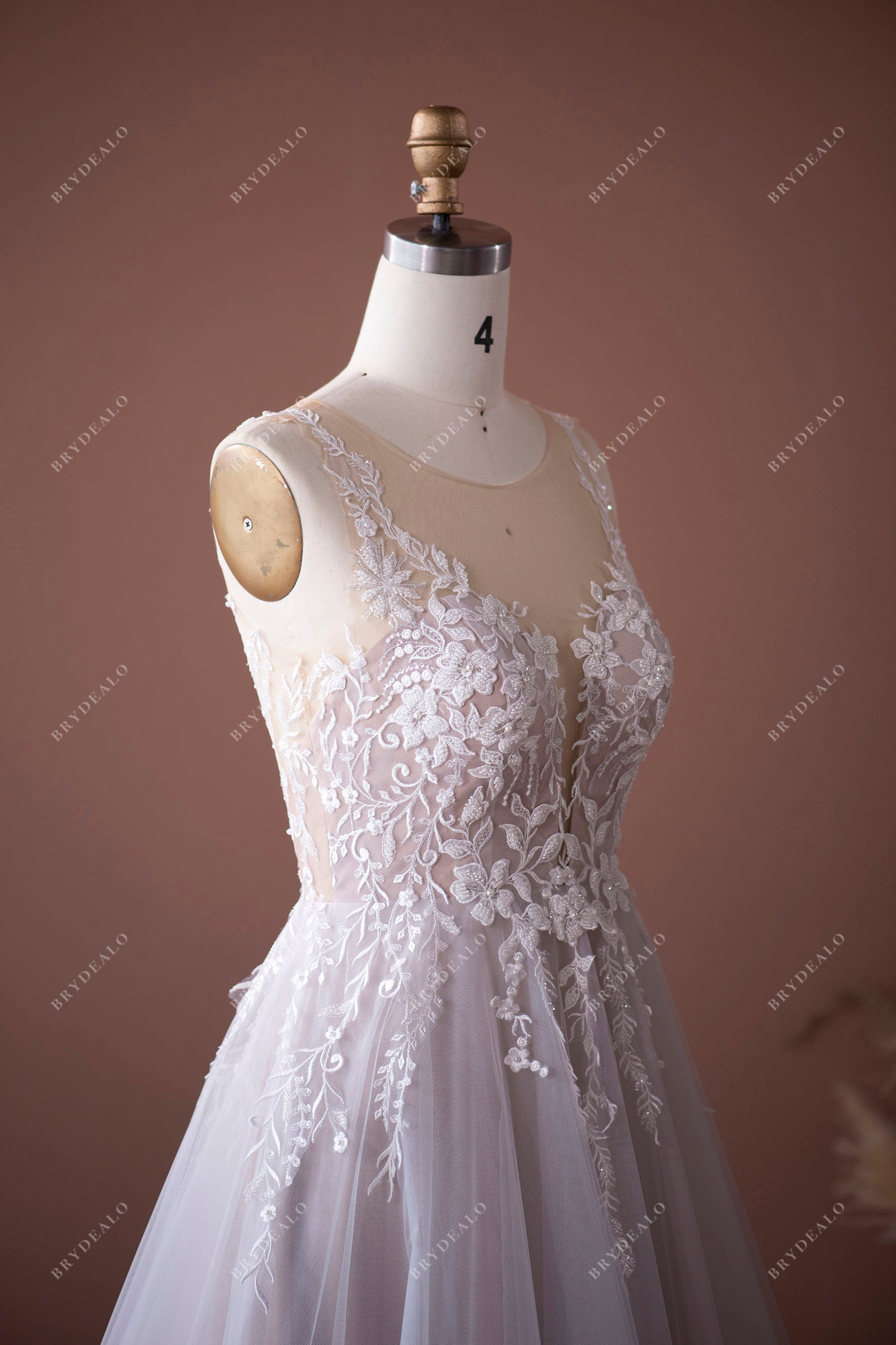 sleeveless beaded lace bridal gown