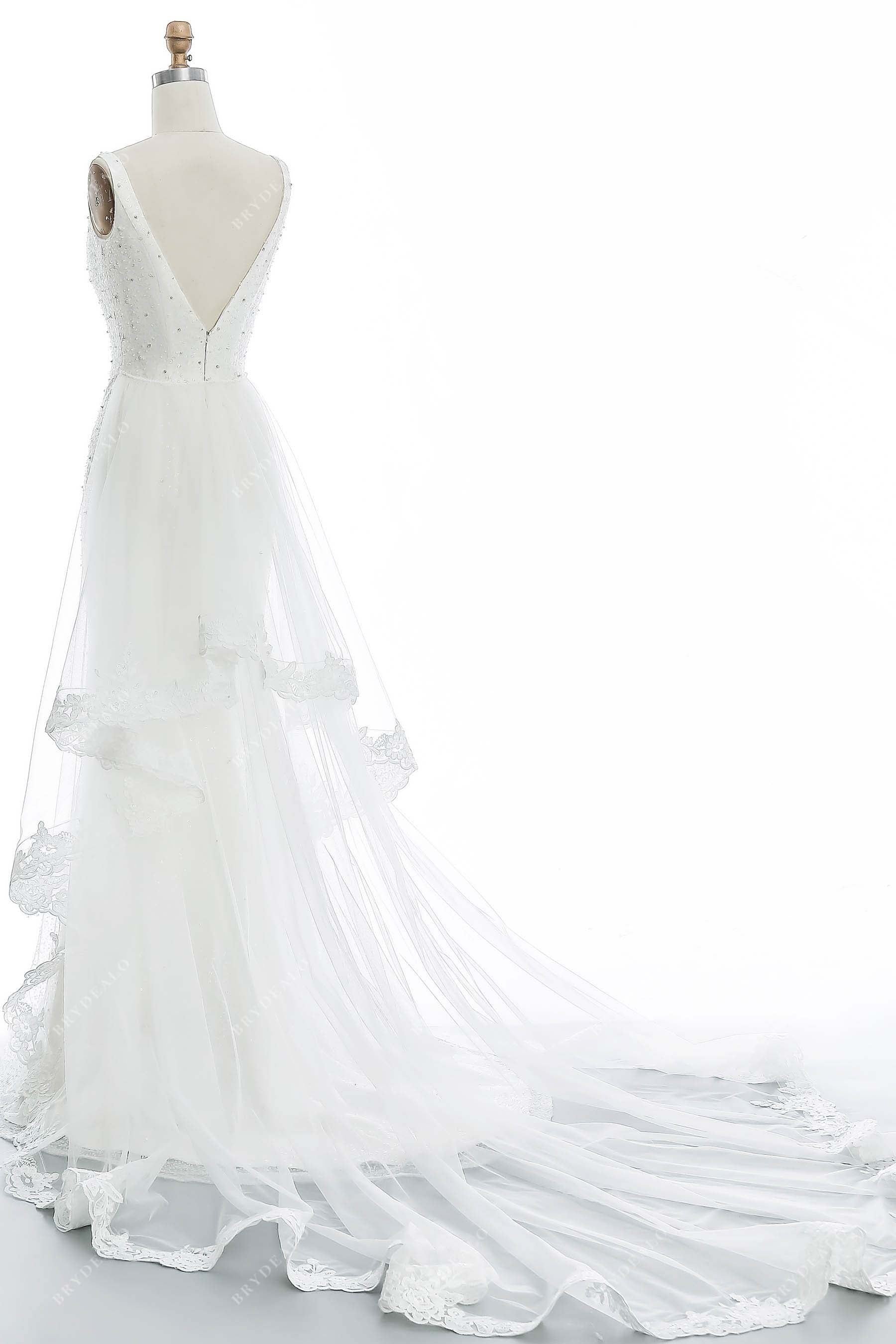 ruffled tulle A-line V-back wedding dress