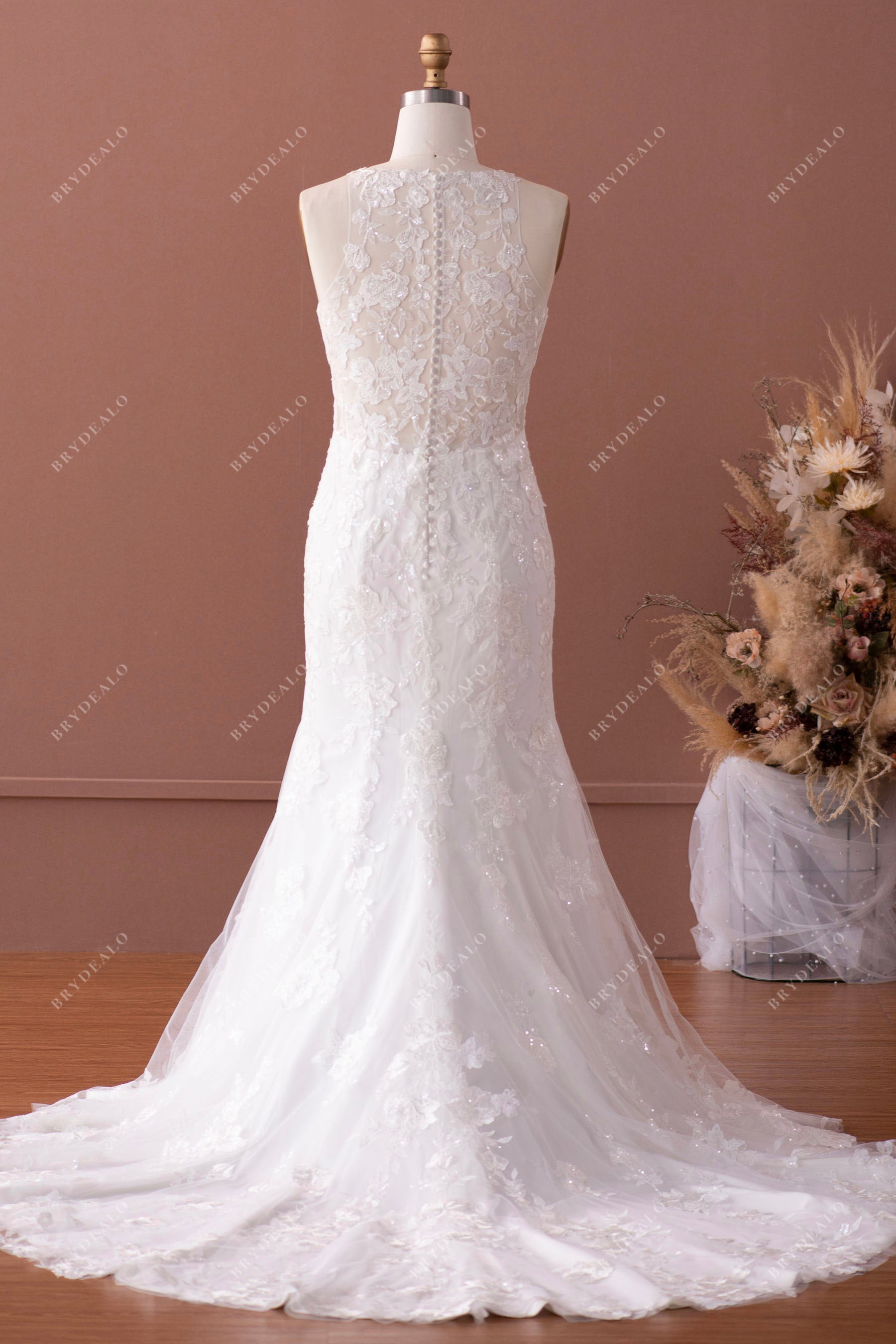 sheer buttoned back long train mermaid wedding gown