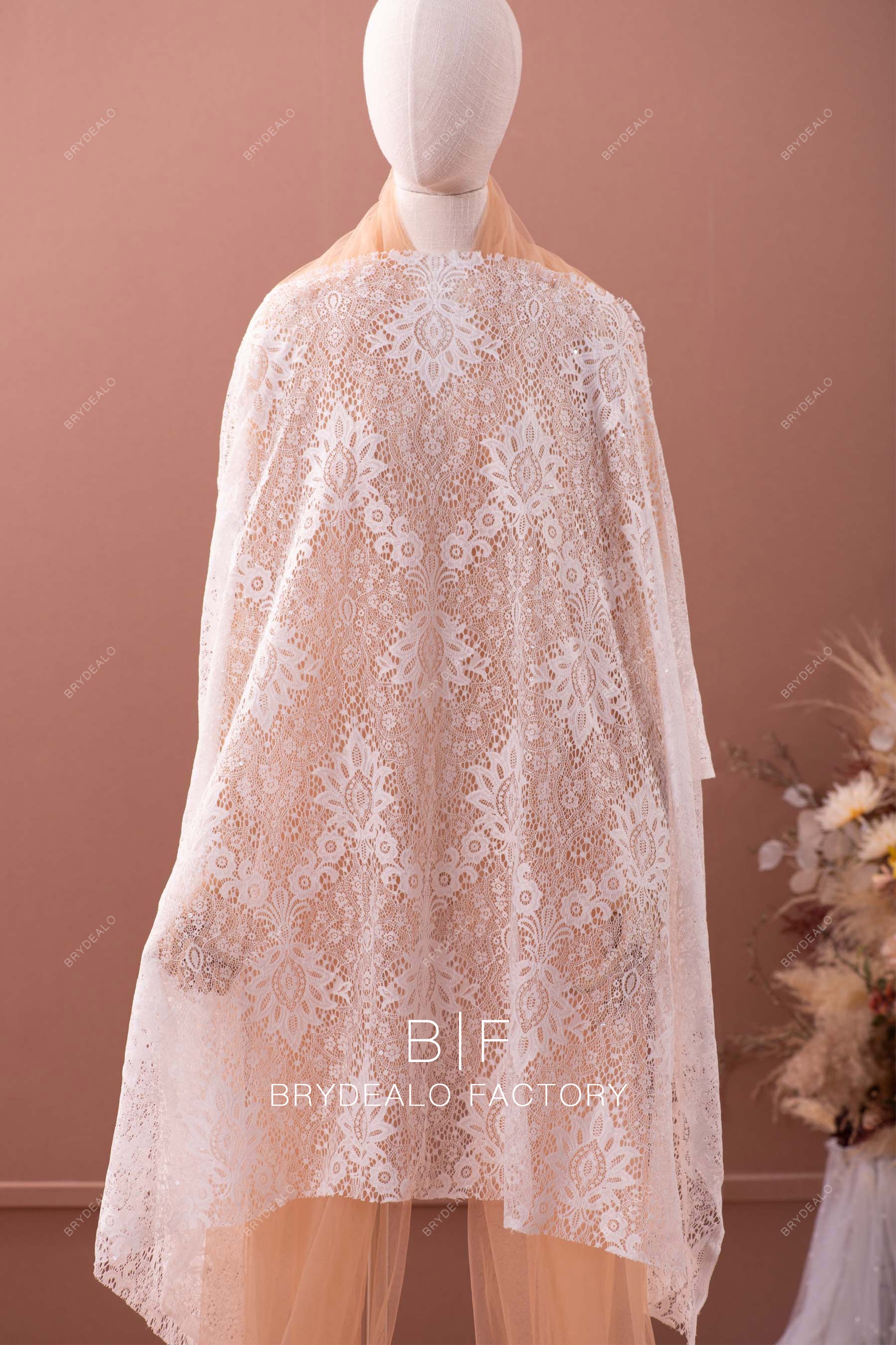 shimmery totemic lace fabric