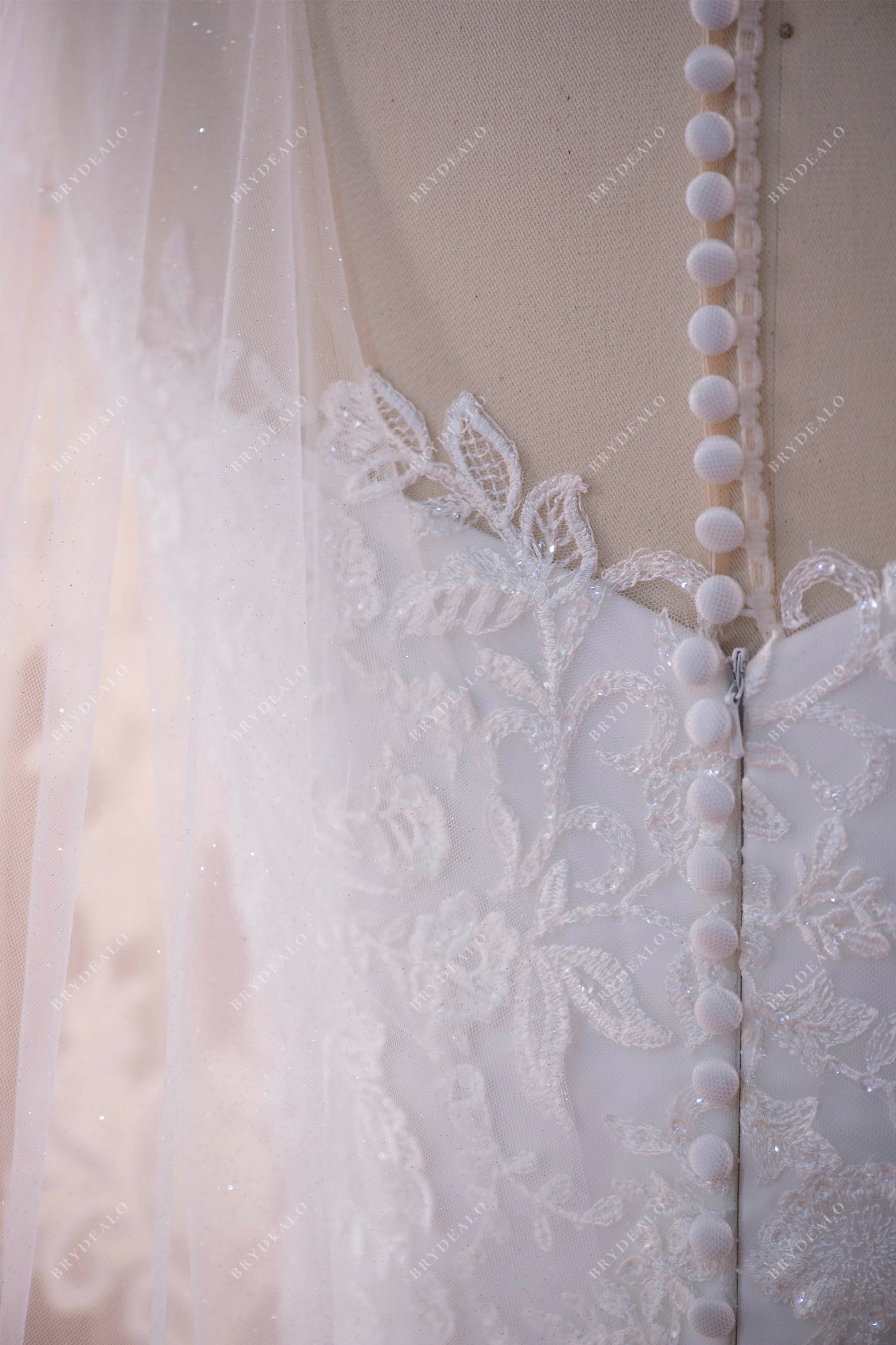 buttoned illusion back wedding dress