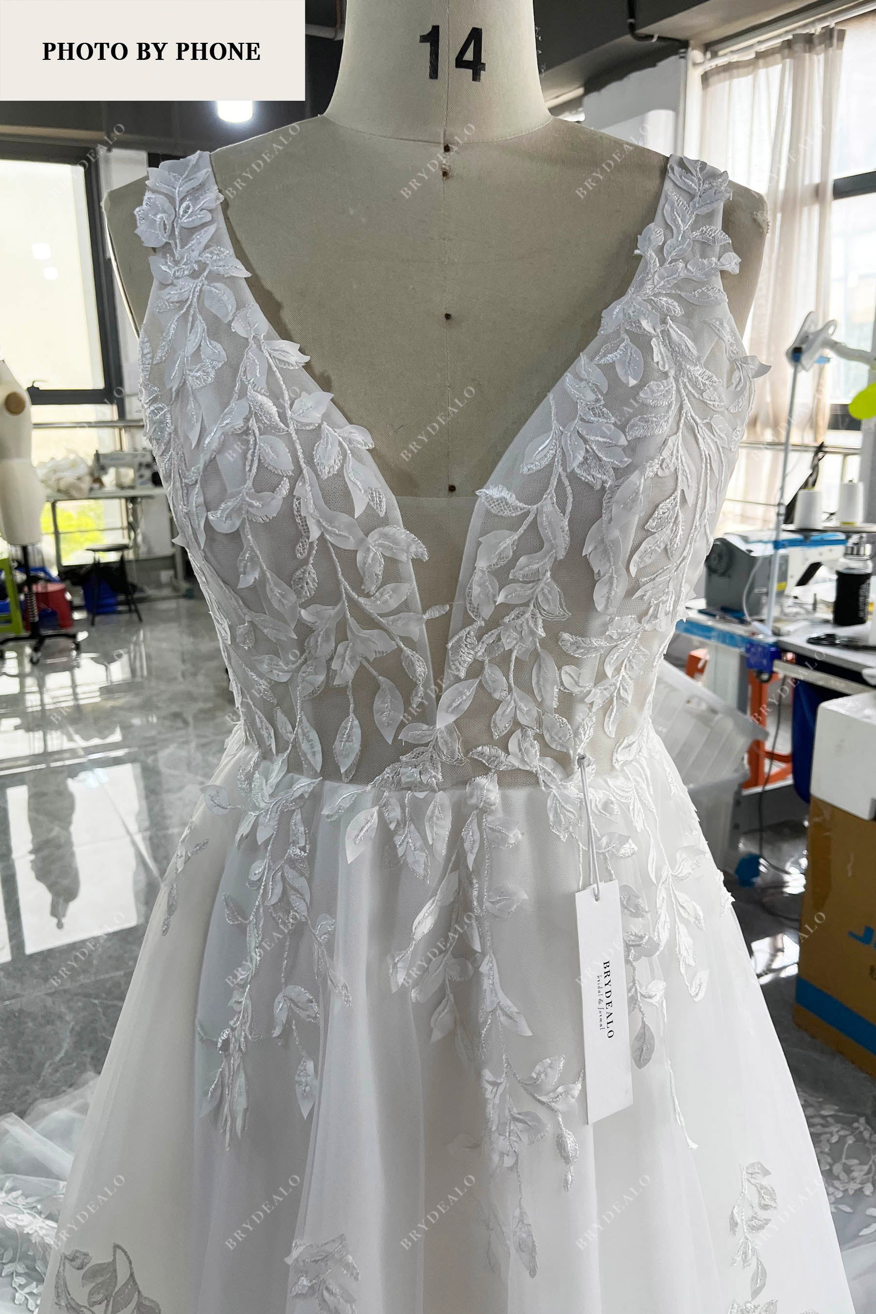 wholesale plunging lace wedding dress real production photo