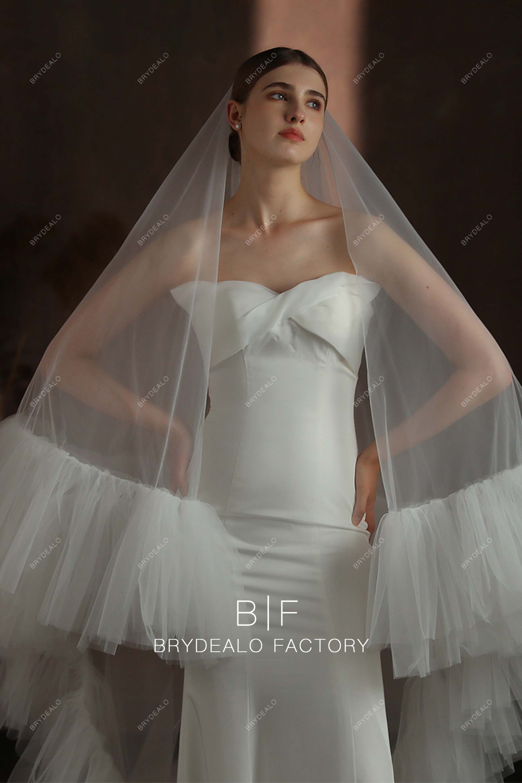 https://brydealofactory.com/cdn/shop/files/Ruffled-Edge-Designer-Wedding-Veil-08171.jpg?v=1697006635&width=1800