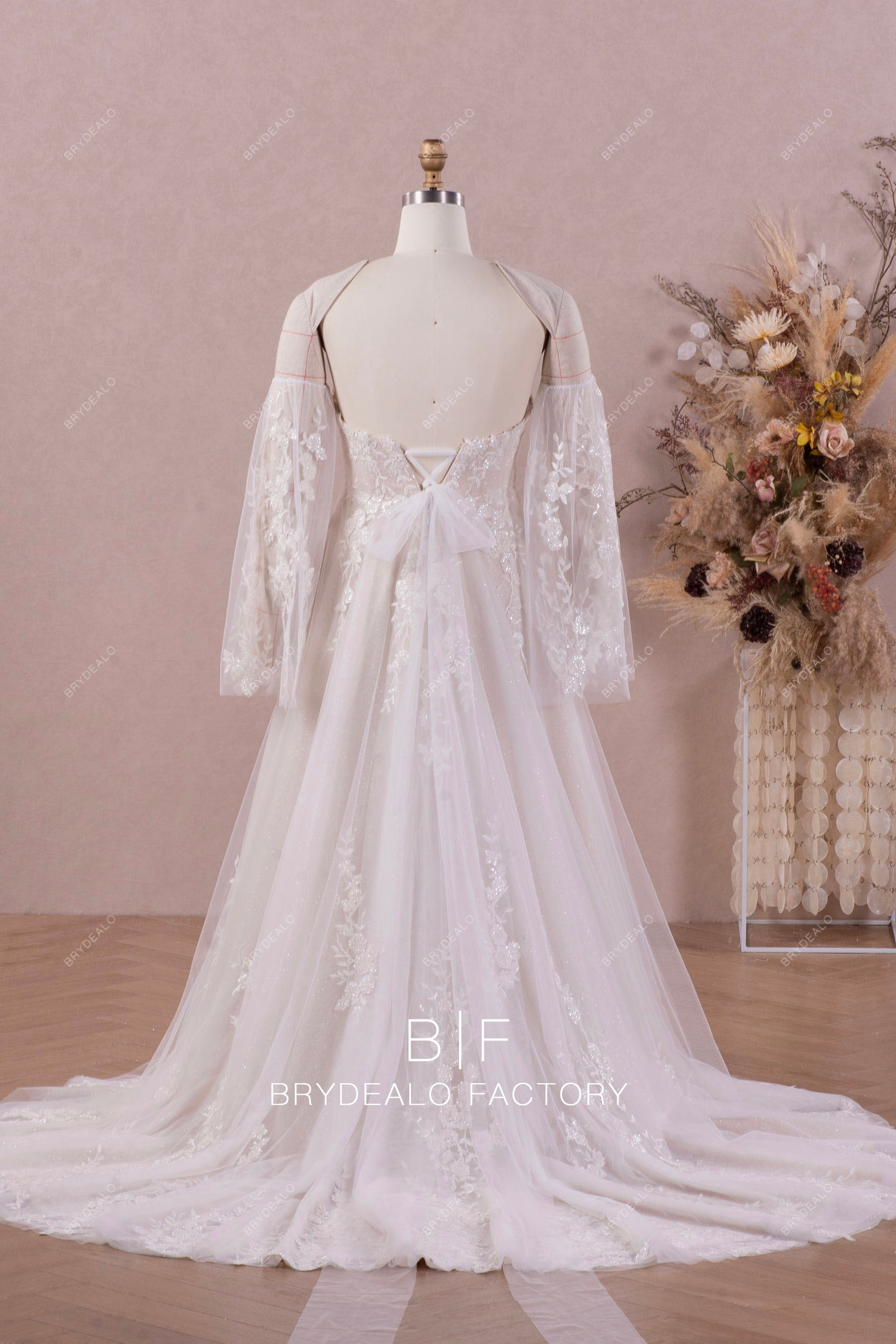 bell sleeved shimmery lace wedding dress