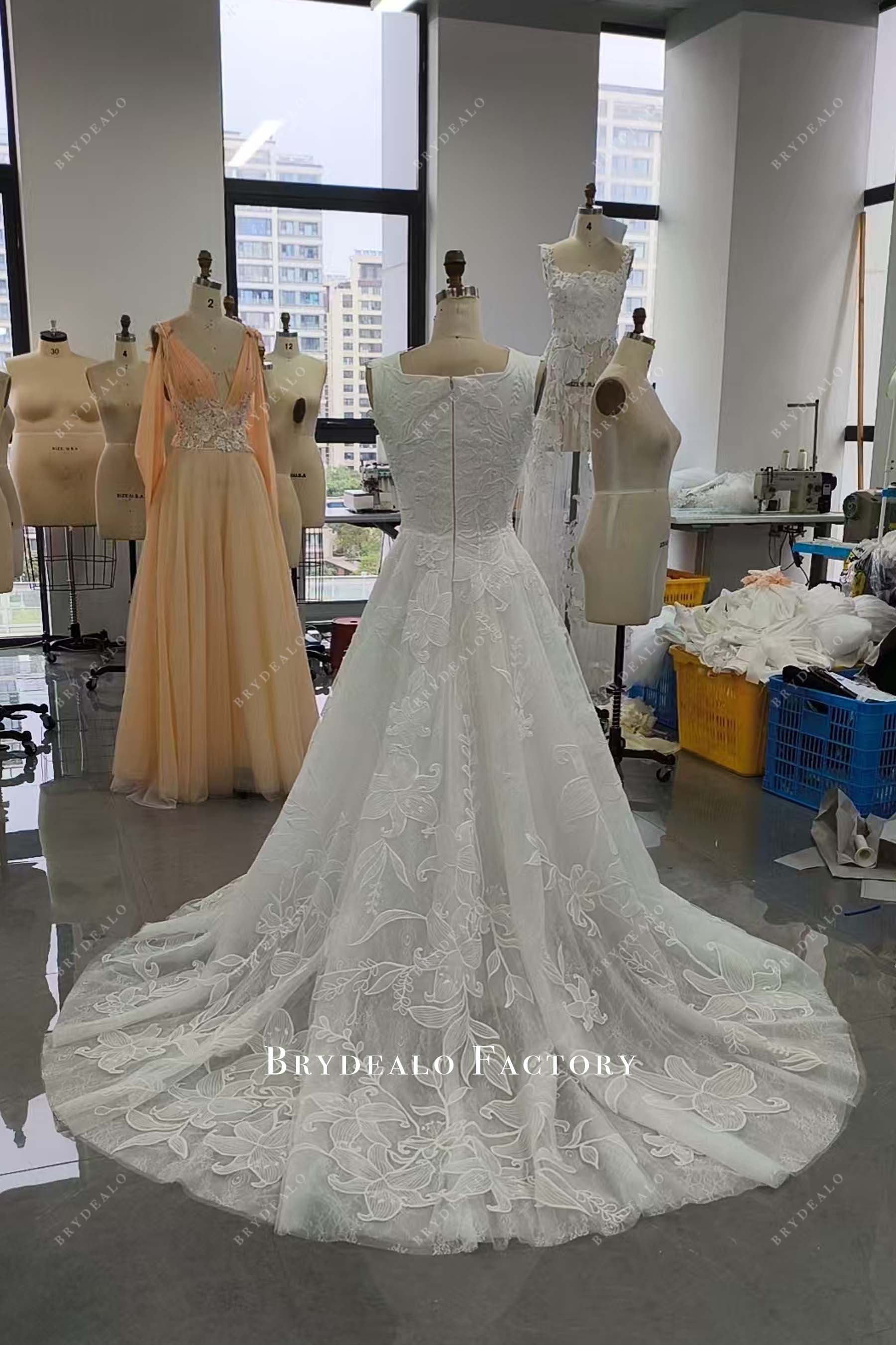 designer lace sleeveless chapel train wedding dress