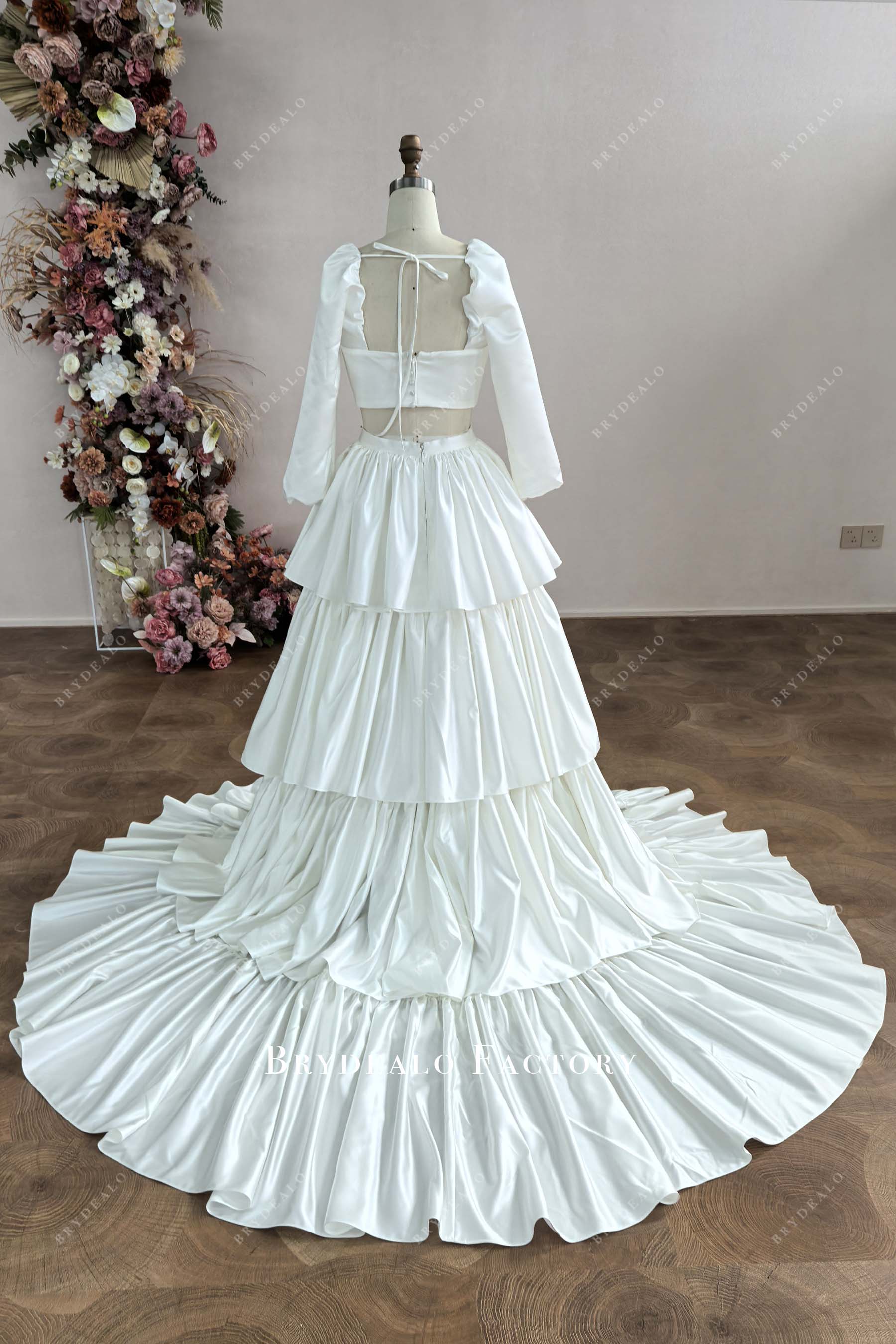 designer satin tiered A-line wedding dress
