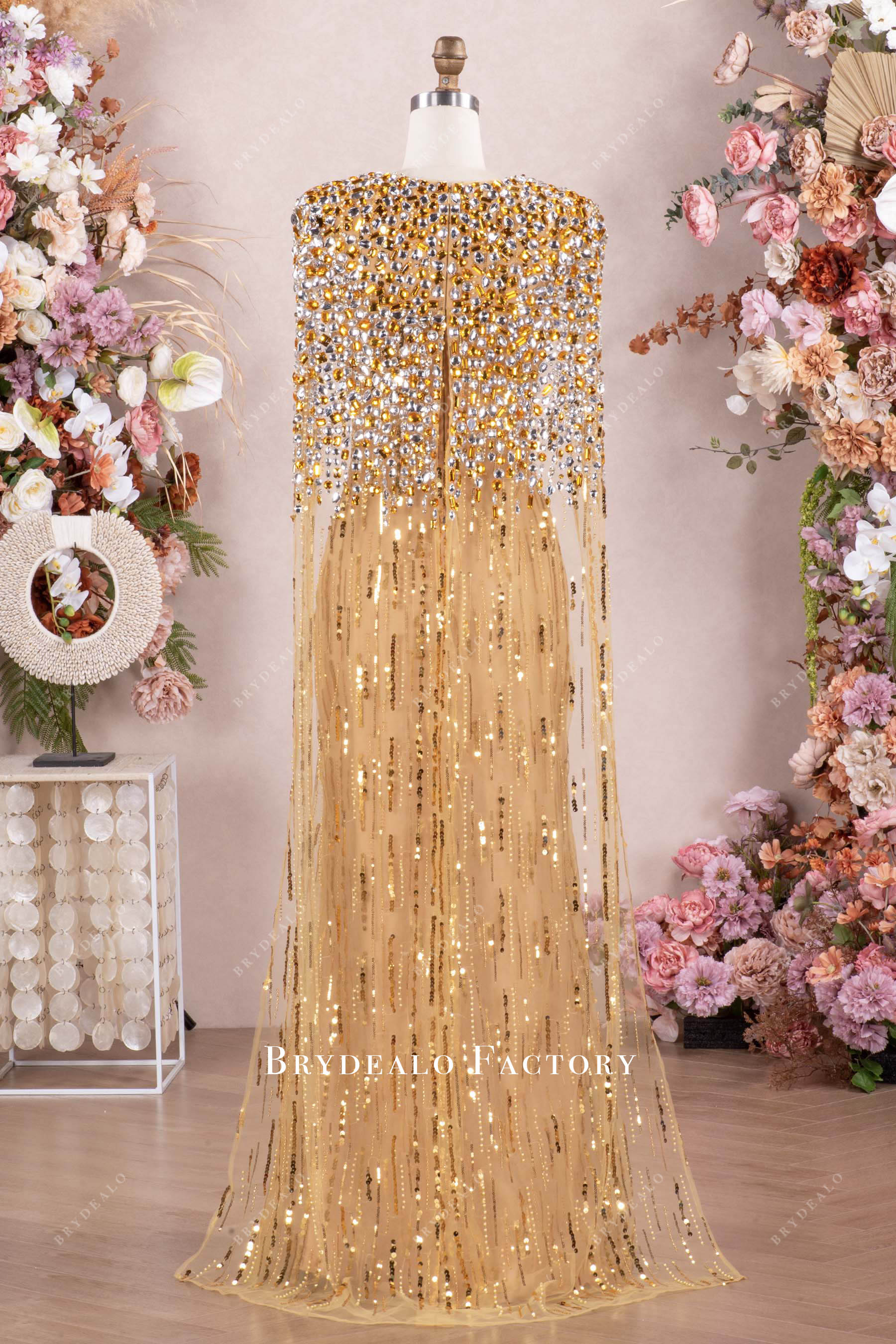 gold cape swept rhinestone dress