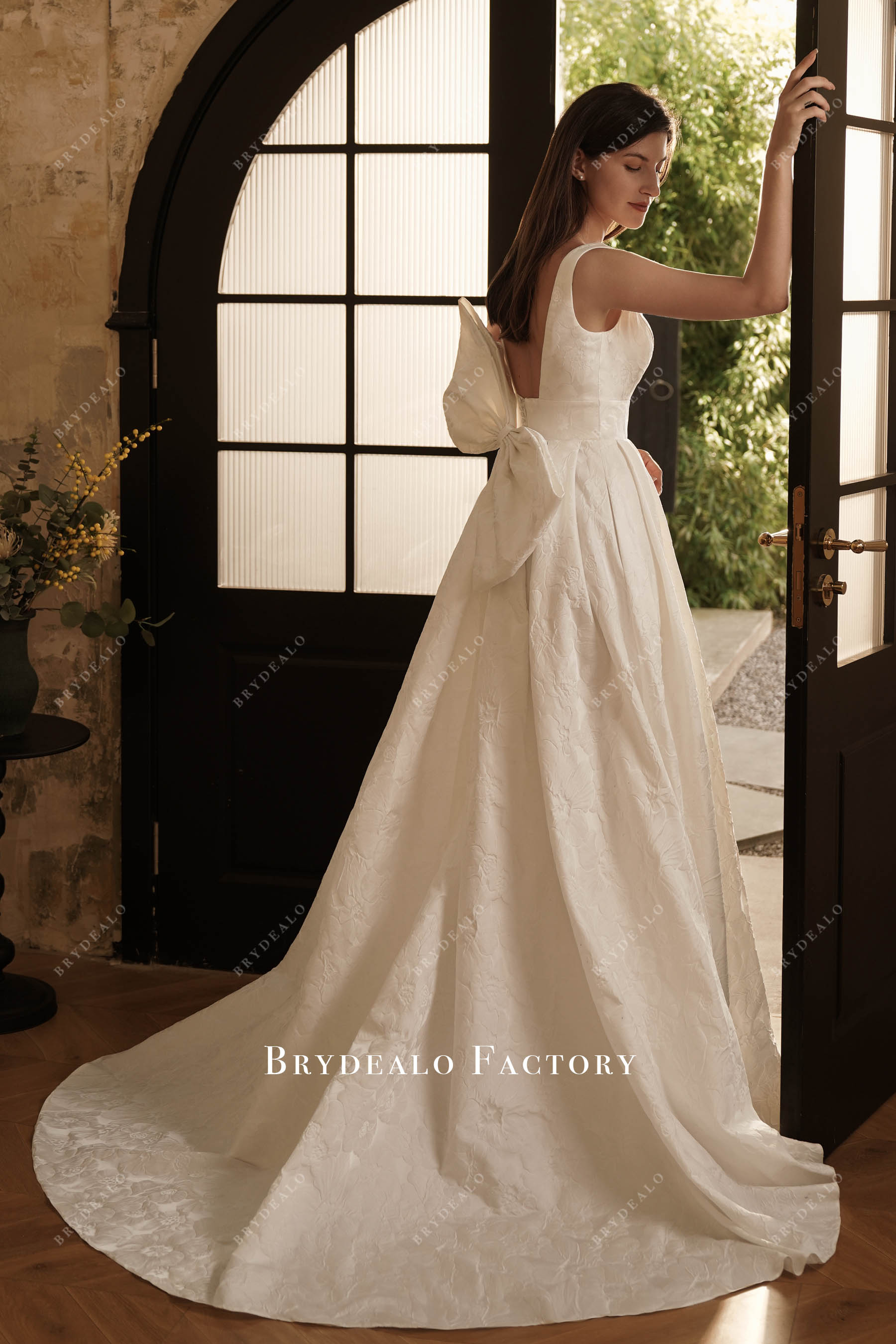 large bow court train wedding dress