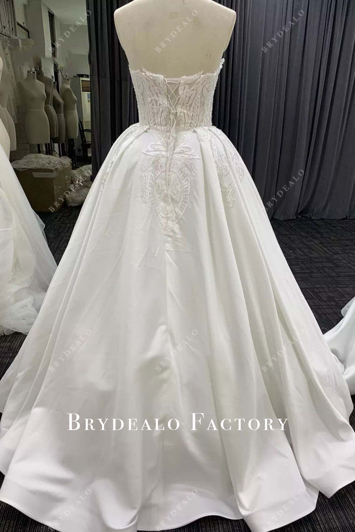 light ivory lace strapless floor length wedding ballgown