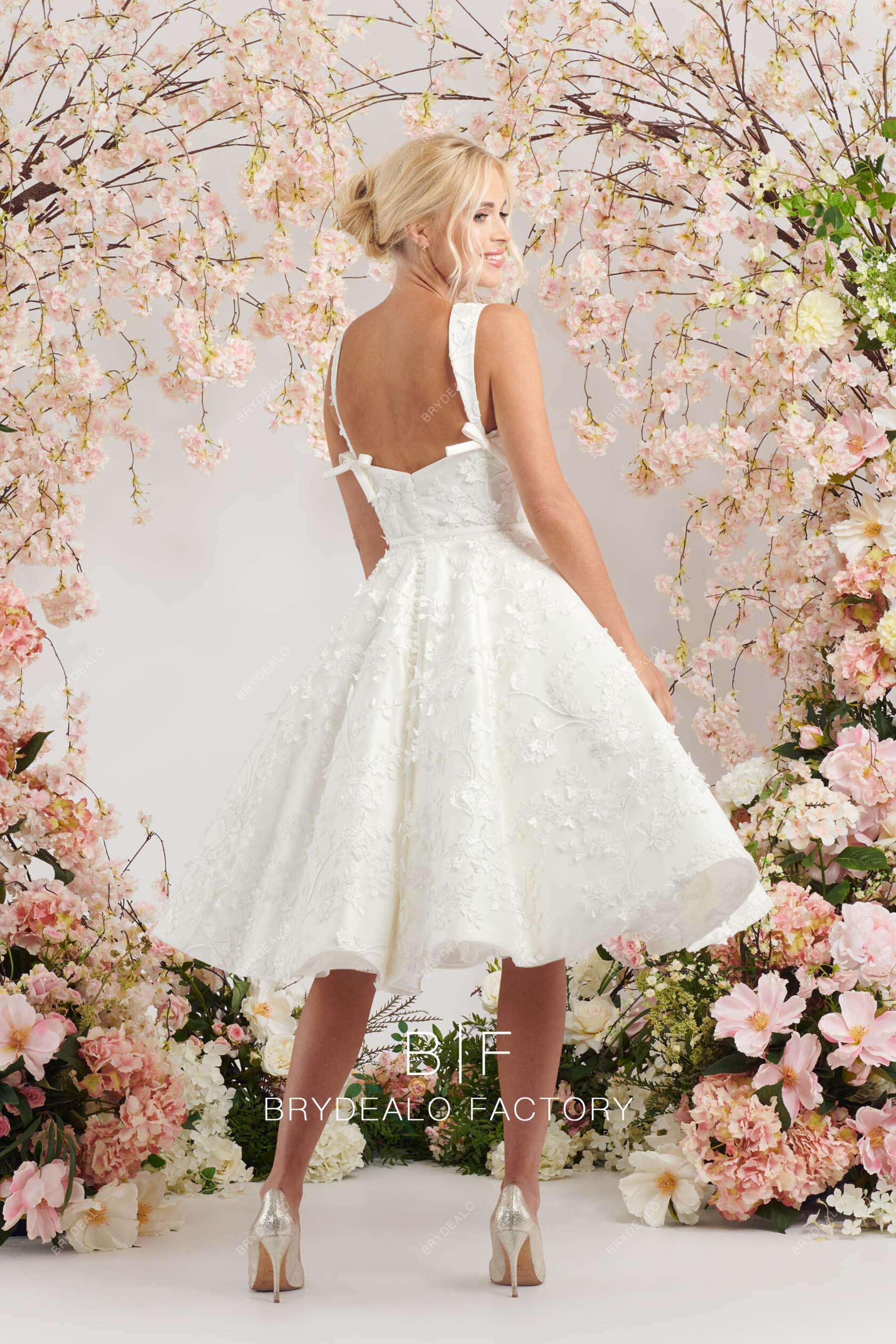 puffy A-line open back lace wedding gown