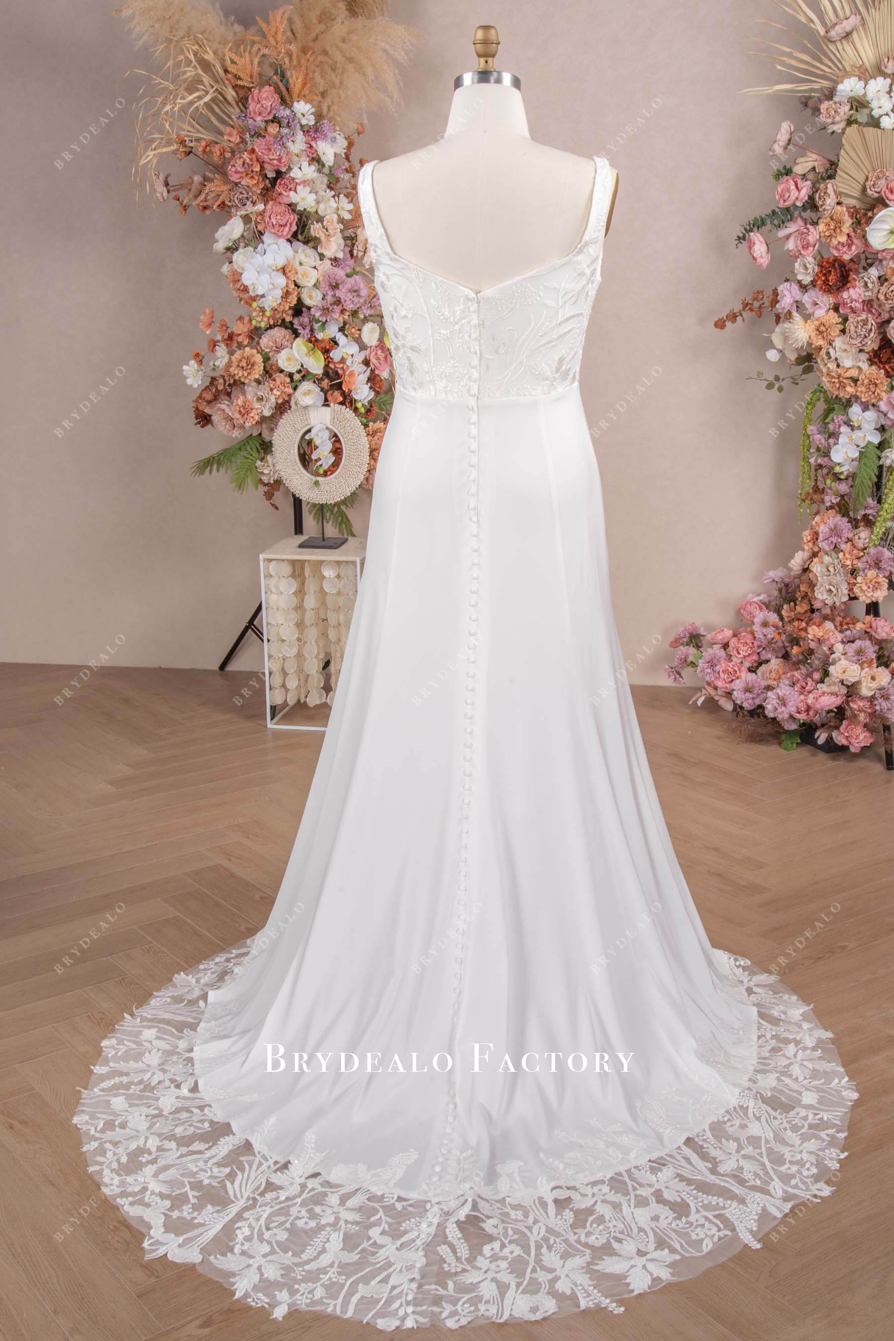 satin buttoned back illusion train wedding gown