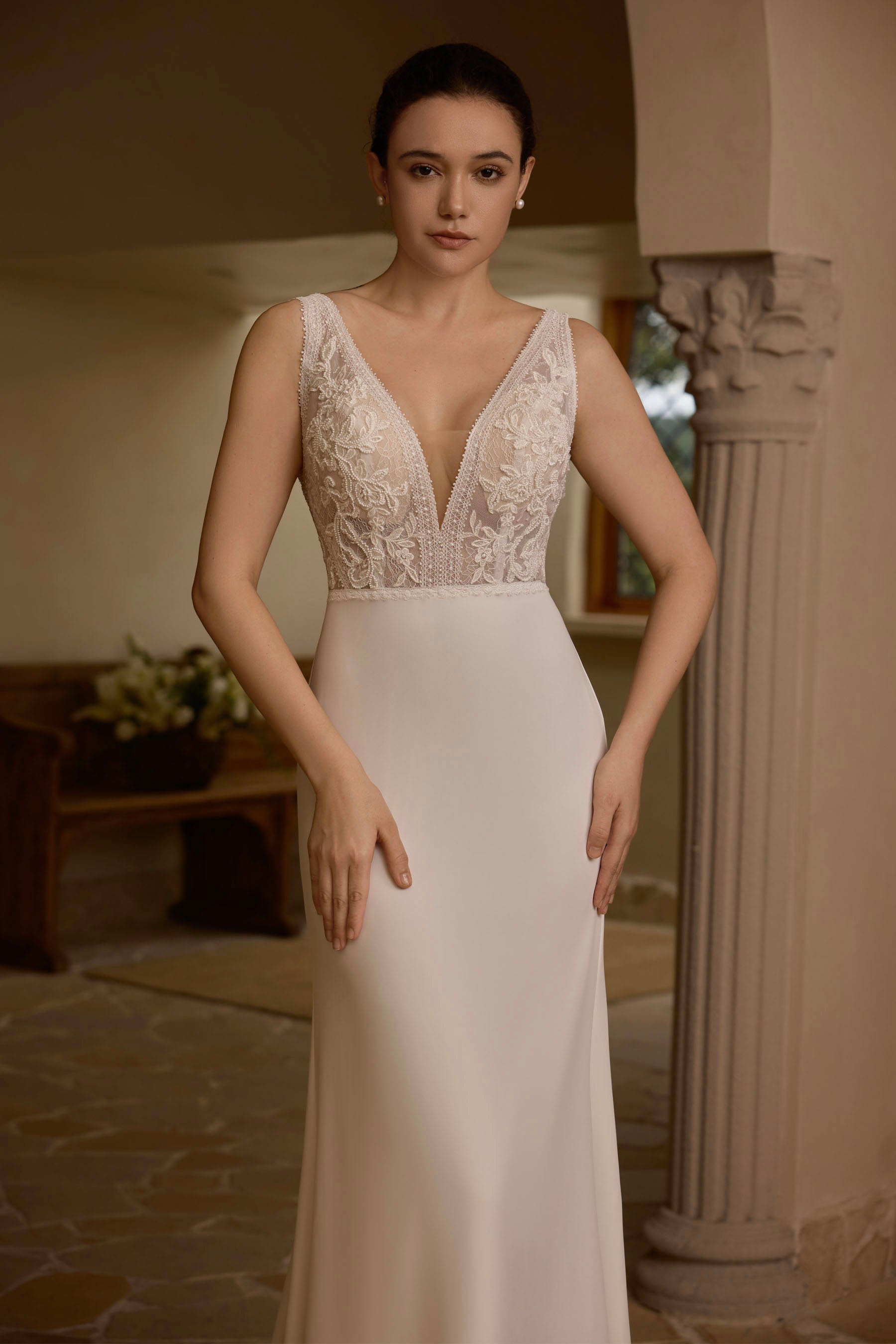 sleeveless crepe buttoned wedding dress