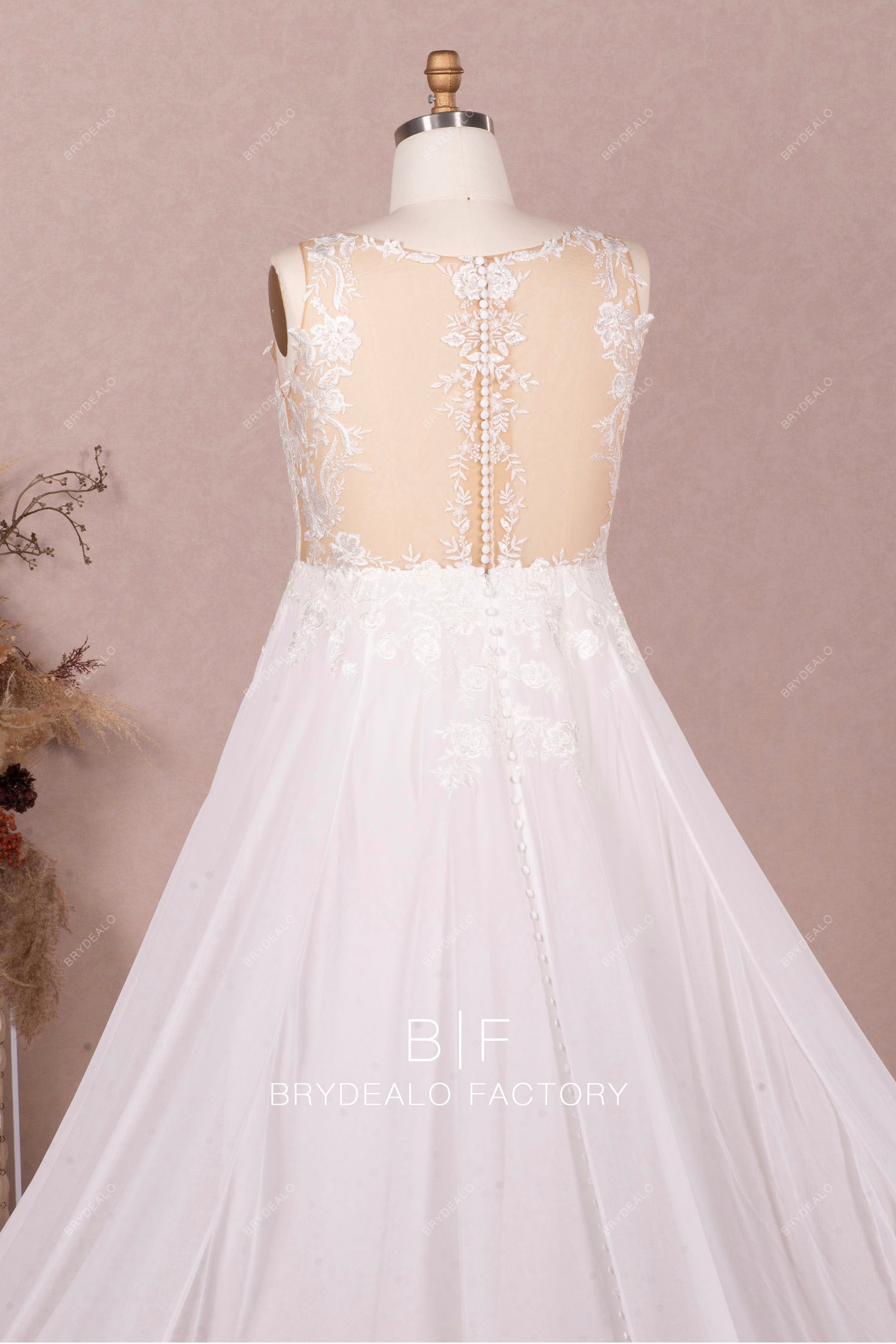 sleeveless sheer lace buttoned back bridal gown