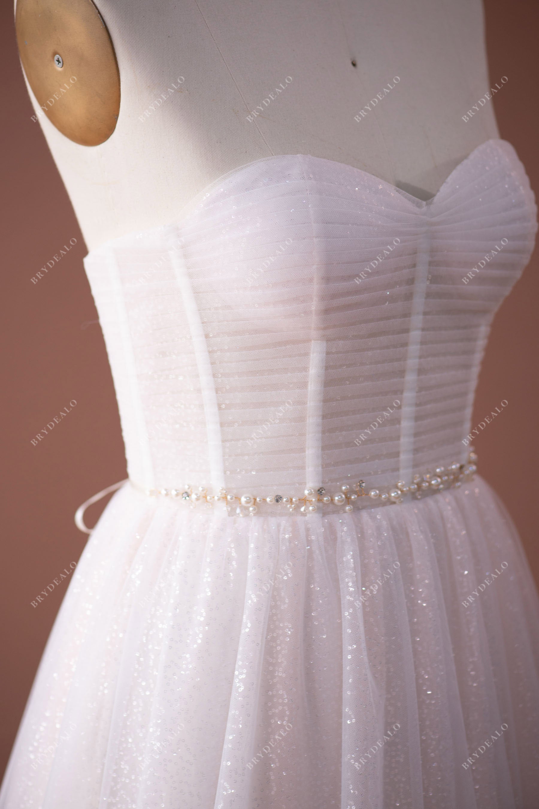 pleated tulle strapless sweetheart neck beaded sash wedding gown