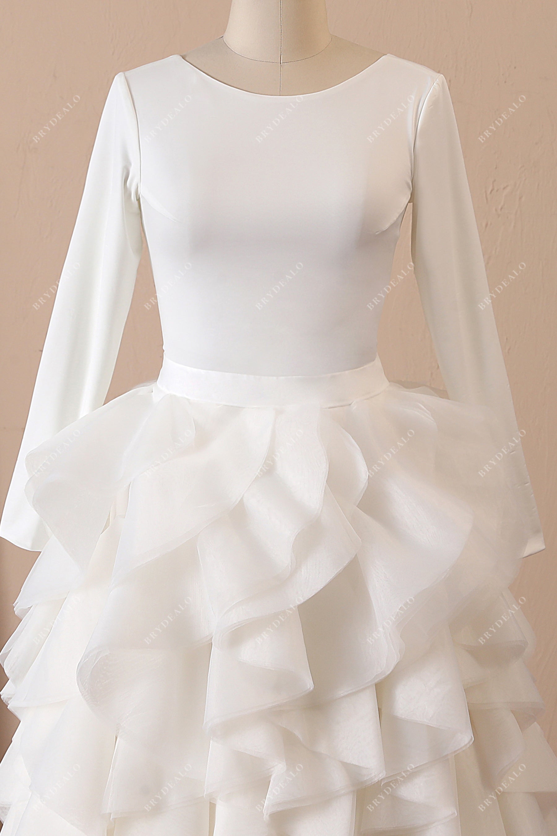 bateau neck ivory crepe sleeved ruffled organza bridal gown