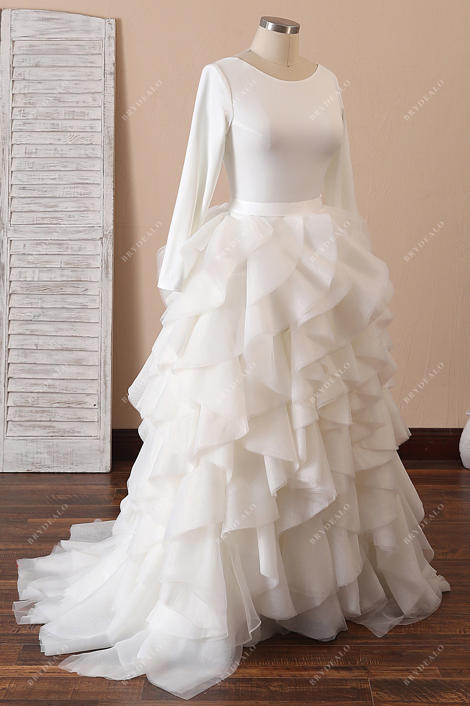 ivory crepe sleeved ruffled organza bridal dress