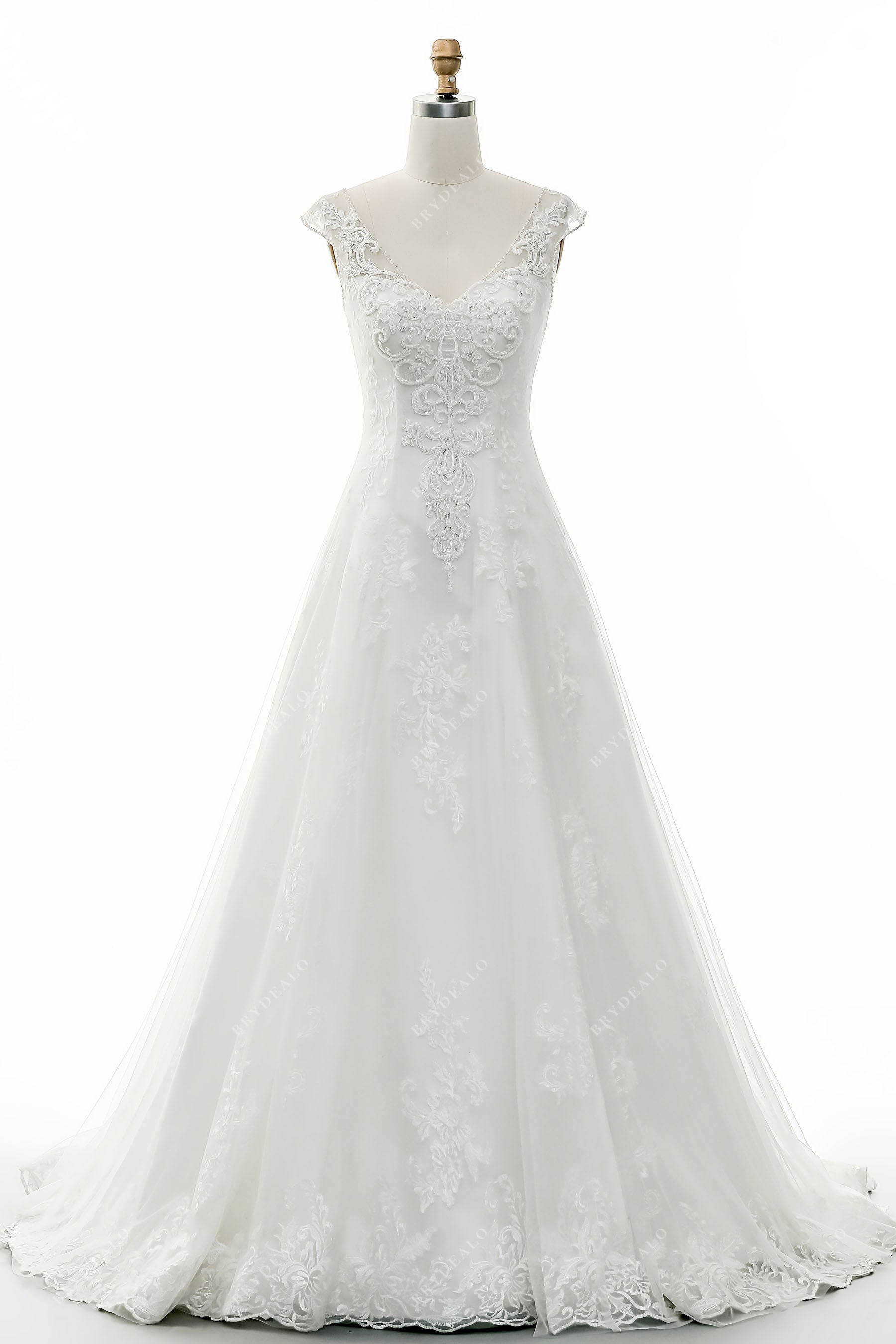 light ivory beaded lace overlaid tulle wedding gown