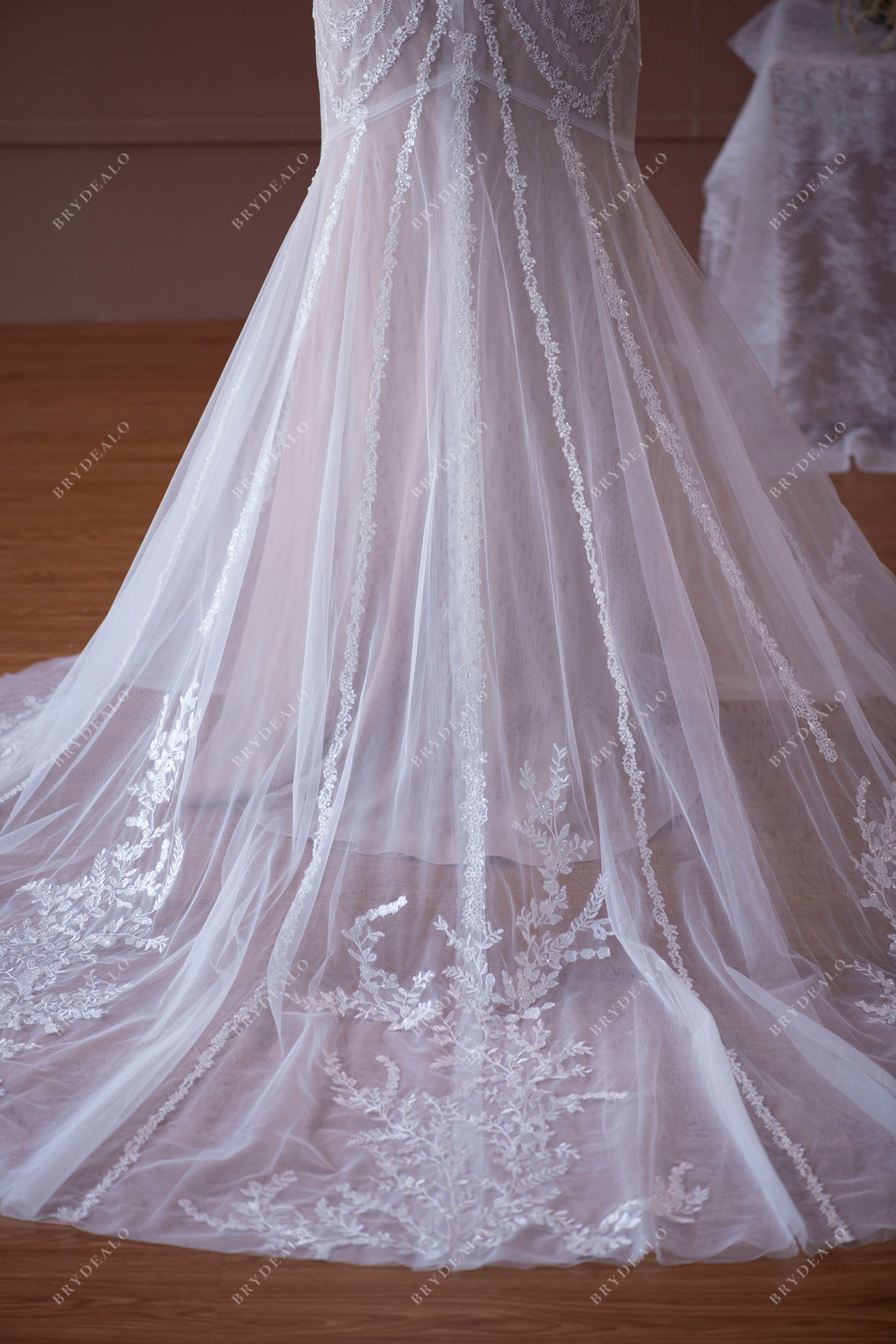 appliqued tulle godet wedding gown