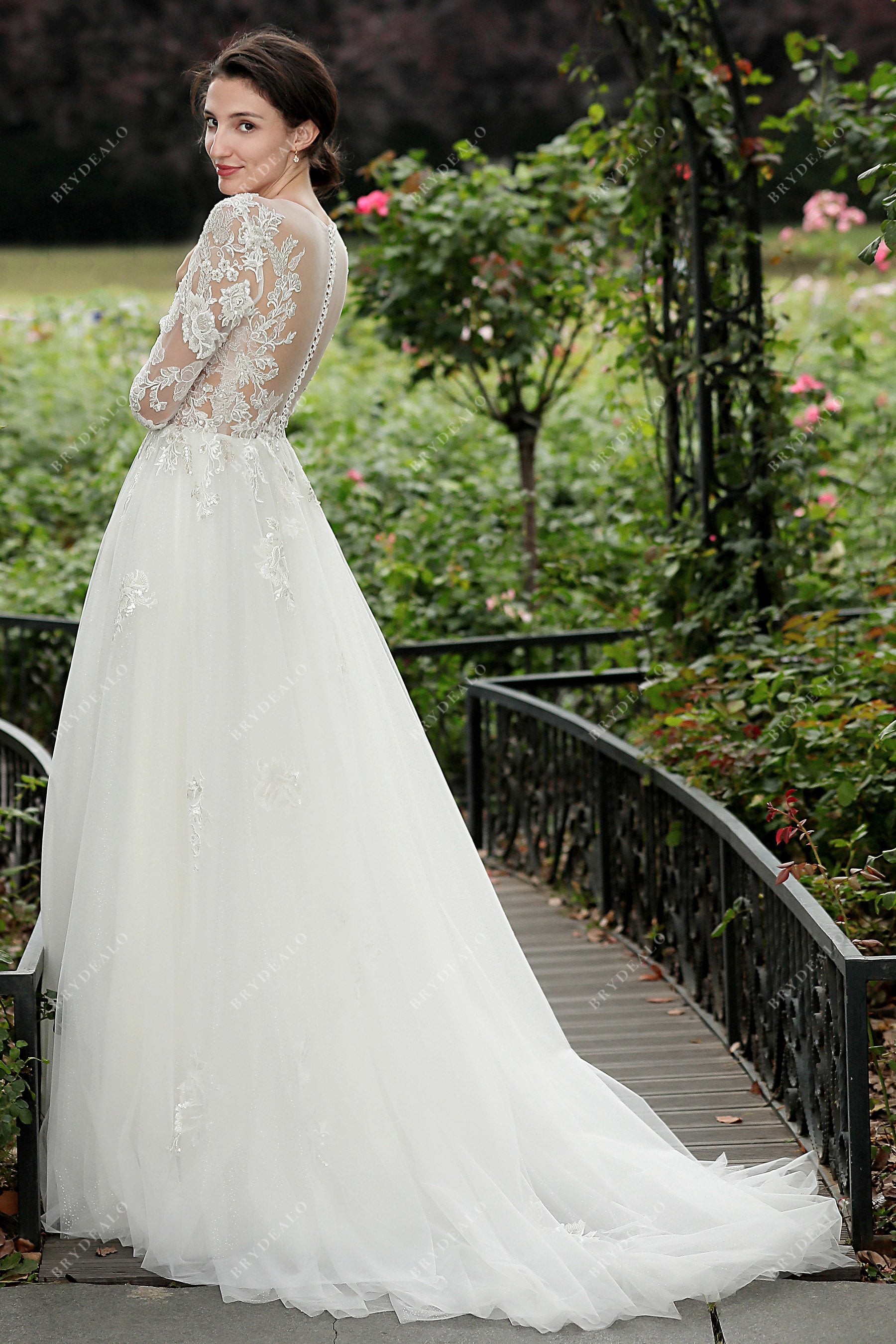 beaded lace sleeved illusion back A-line bridal gown