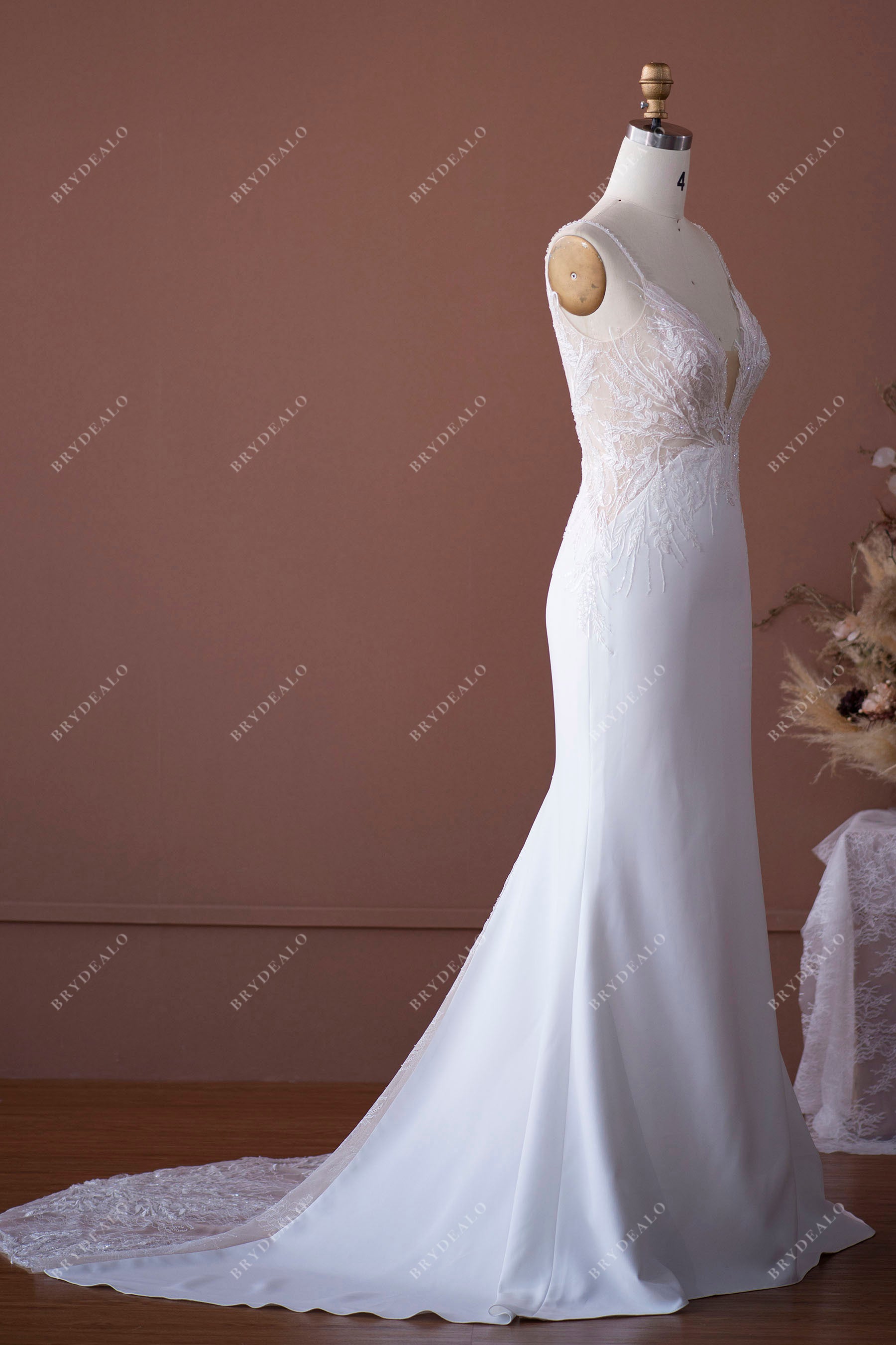 sleeveless plunging lace crepe bridal gown