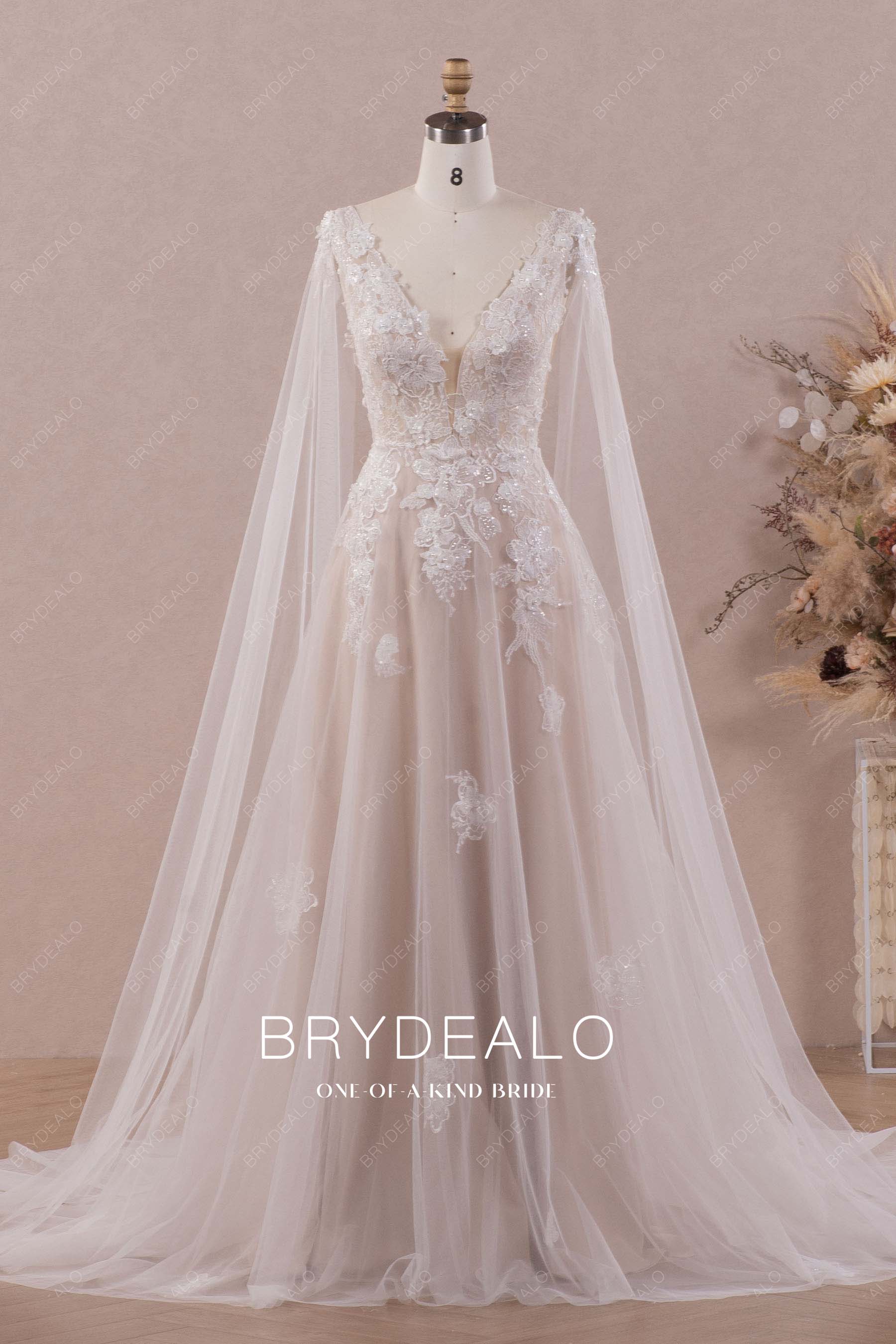 ethereal luxury lace shoulder cape wedding gown